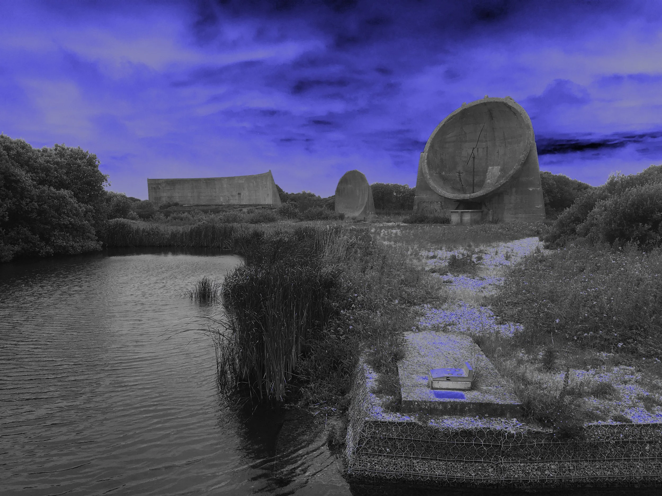 Sound mirrors with a neon filter at Dungeness, Kent 