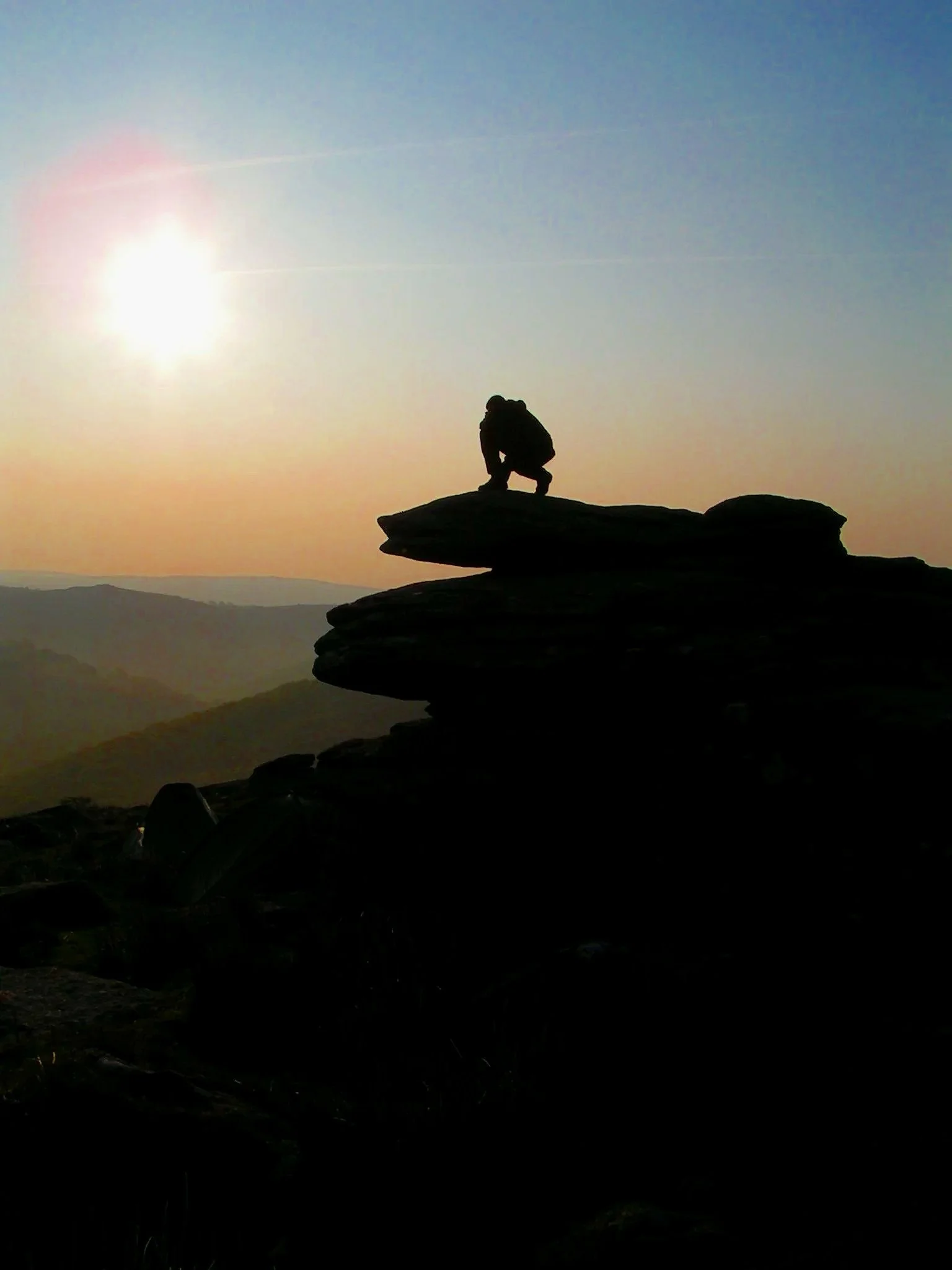 Sun setting on Combestone Tor,  Dartmoor