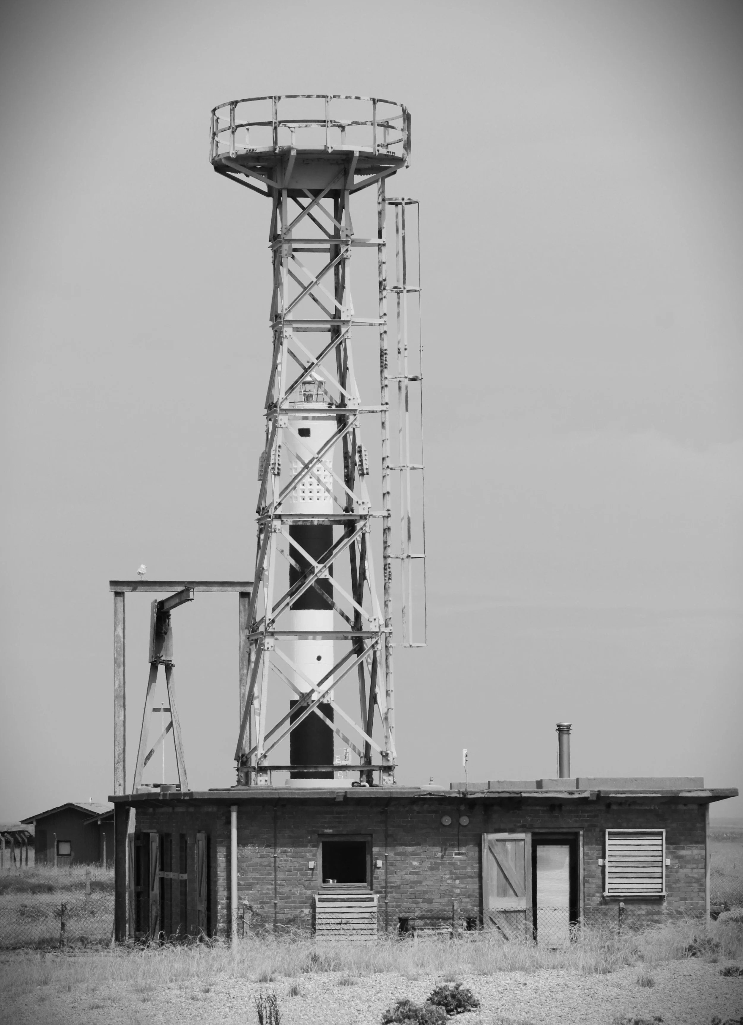 New Lighthouse at Dungeness framed by the old Radar Tower