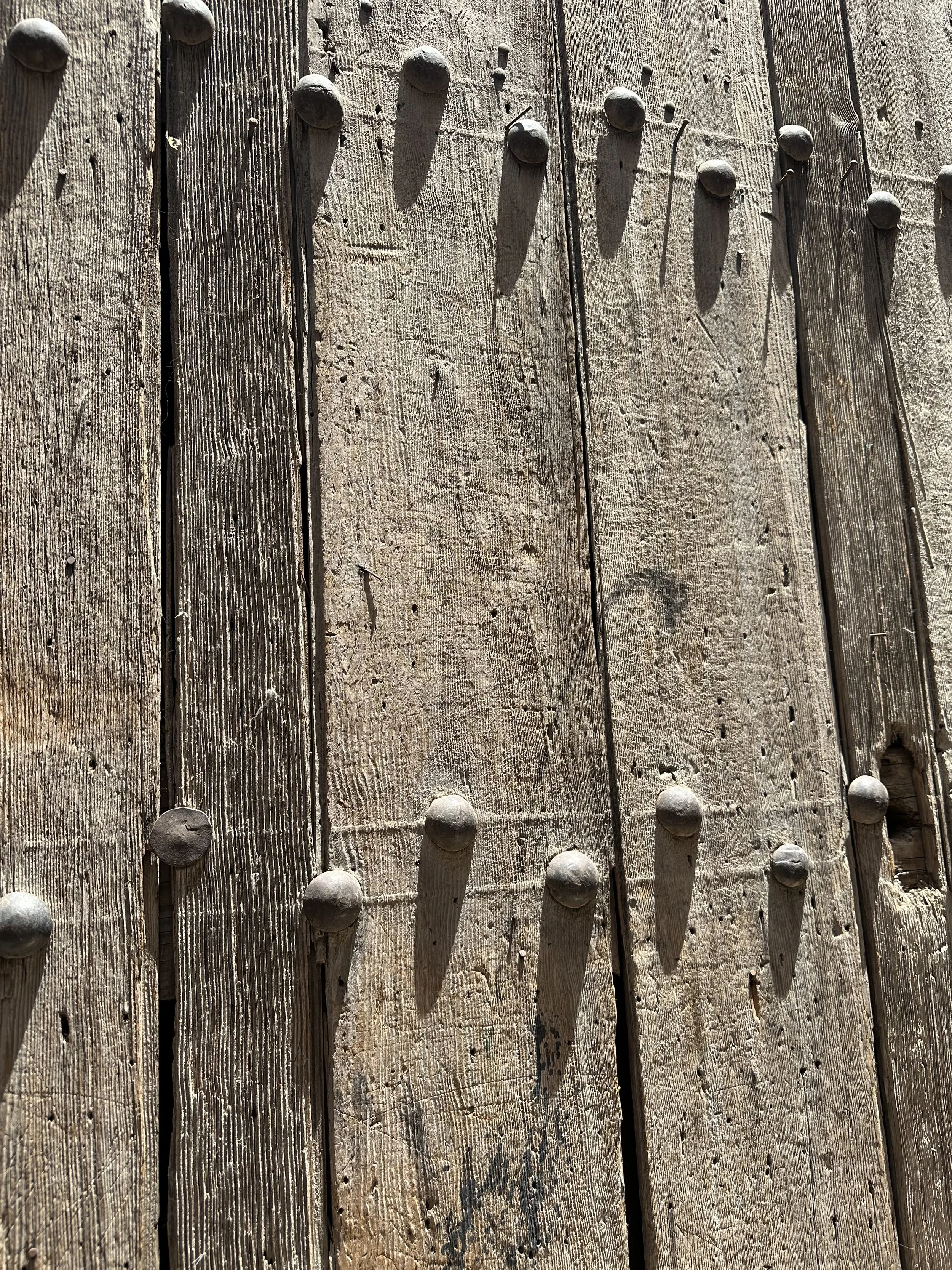 Old wooden door with Iron rivets in Marrakech, Morocco