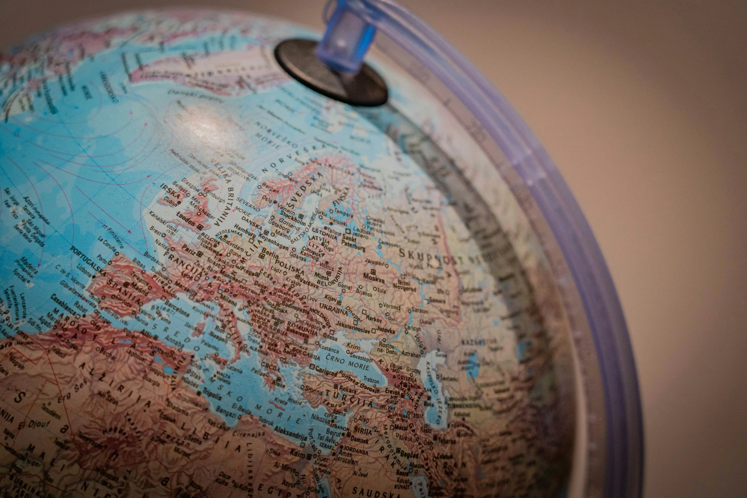 Close-up of a globe focusing on Europe, with a globe stand partly visible at the top.