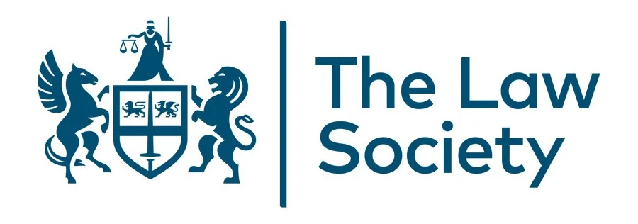 Logo of The Law Society featuring a shield with lions, supported by a horse and a lion, with a woman holding scales and a sword above the shield, and the text 'The Law Society' to the right.