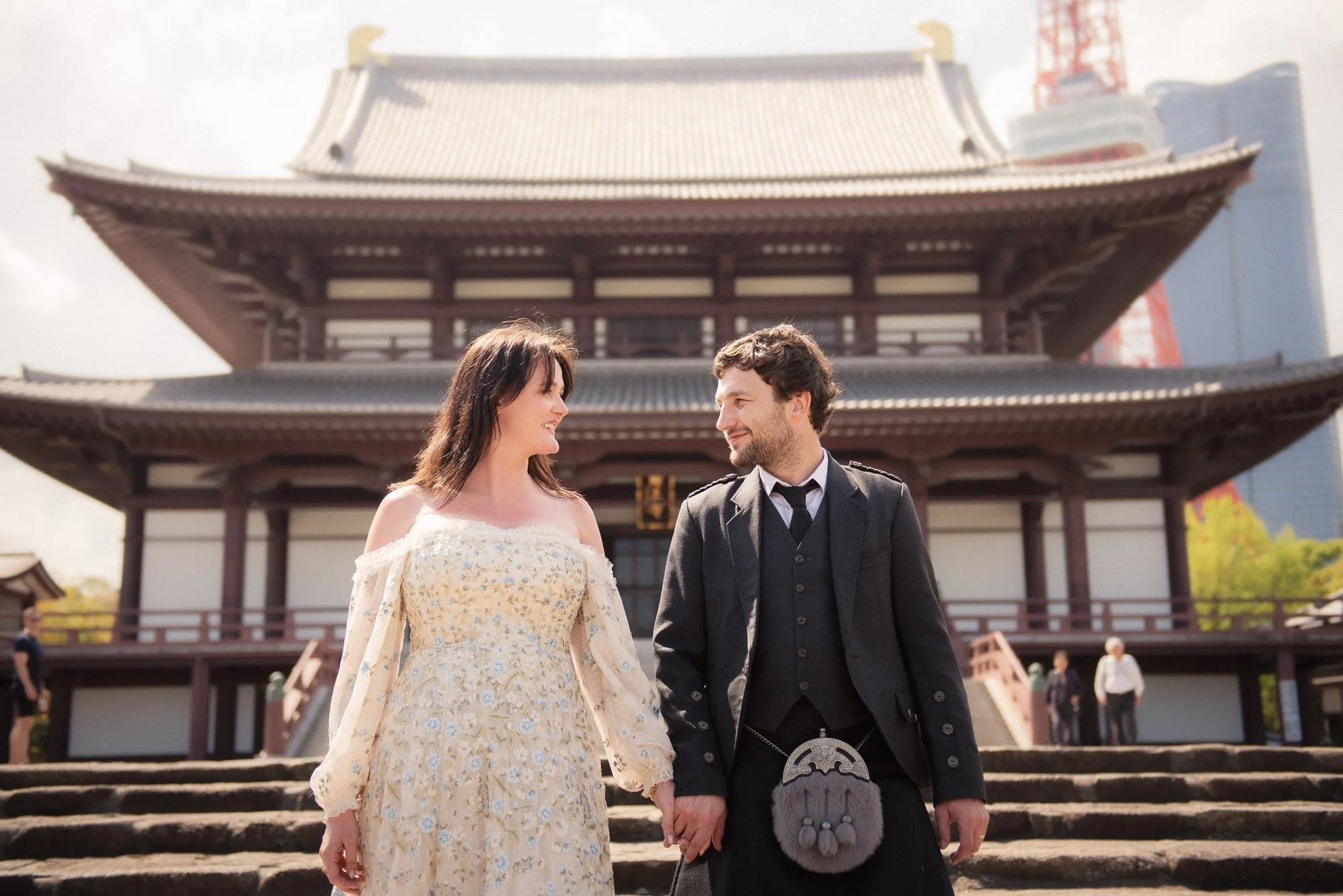 A young just-married couple enjoy quiet moment at iconic Tokyo Temple.