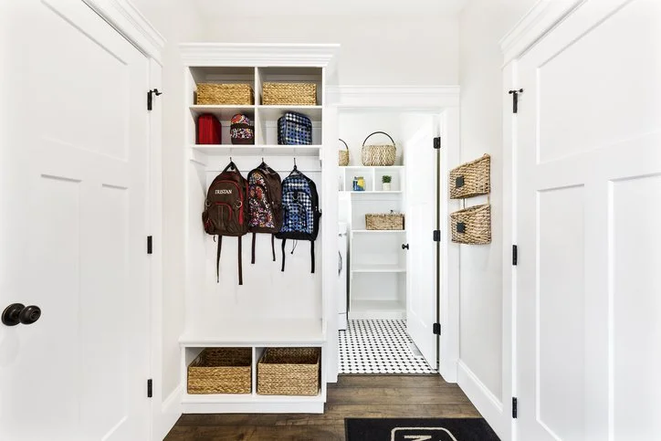 Organized entryway with custom mudroom built-ins in a Boston residence