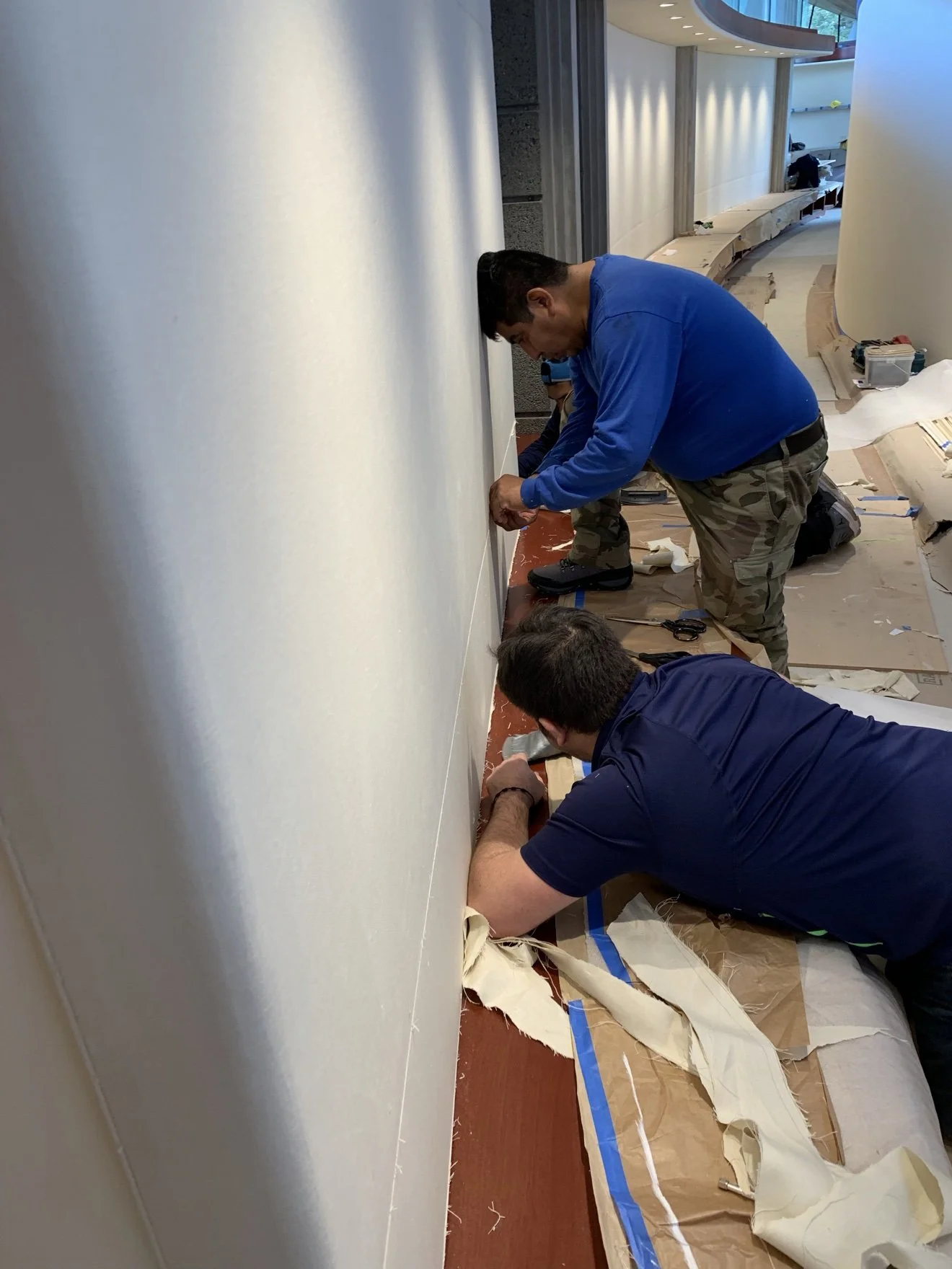 Technicians aligning a Whisper Wall panel