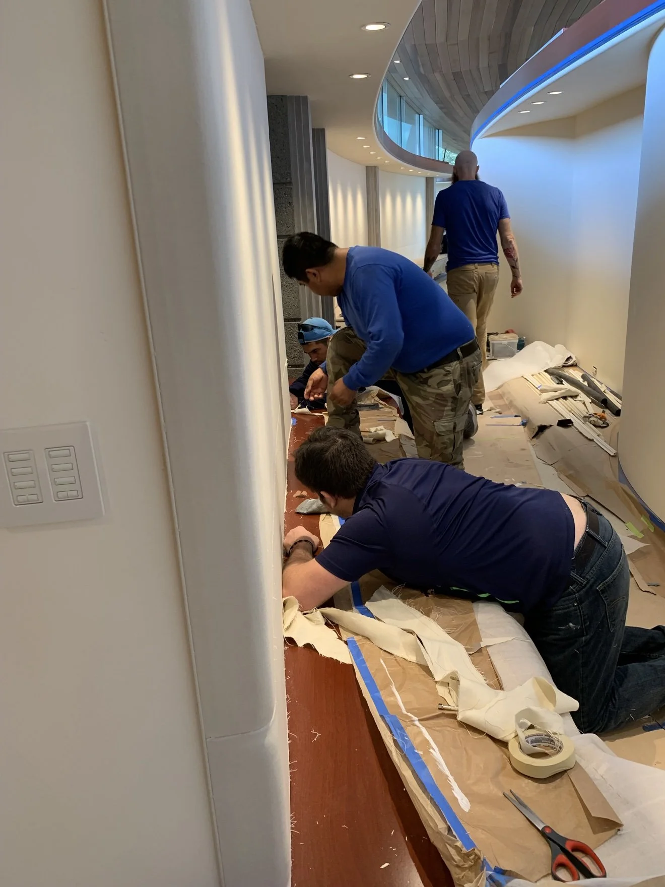 Technician trimming a Whisper Wall panel