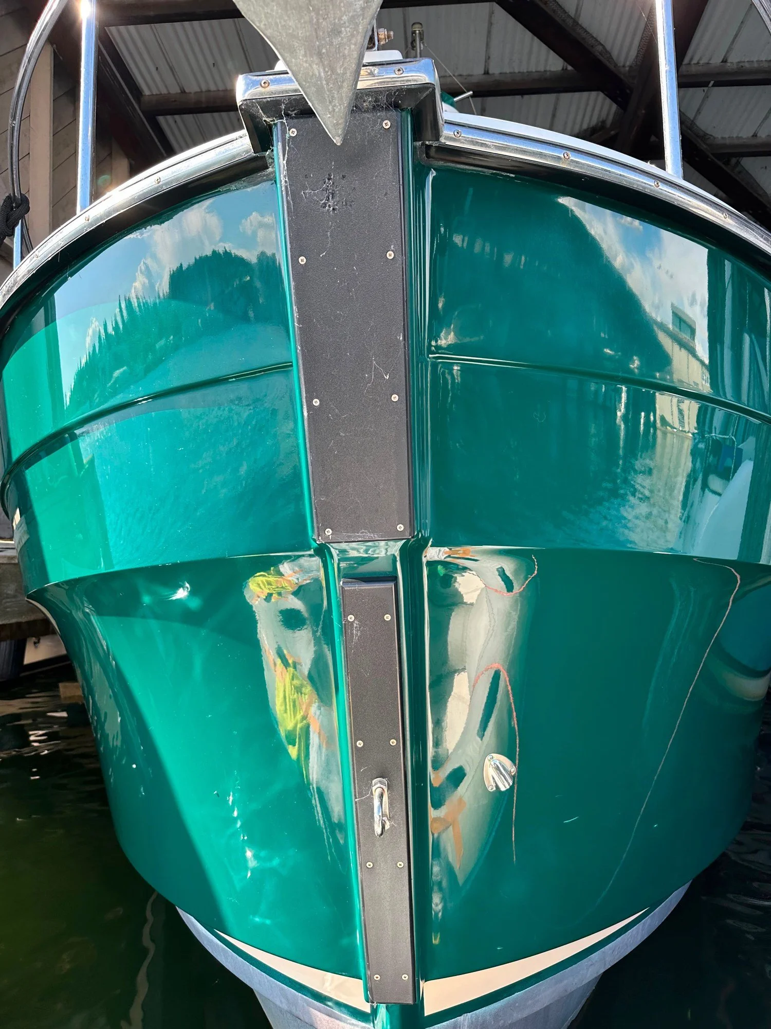 Tug Life green bow after wet sanding and multi-step polishing, glossy gelcoat