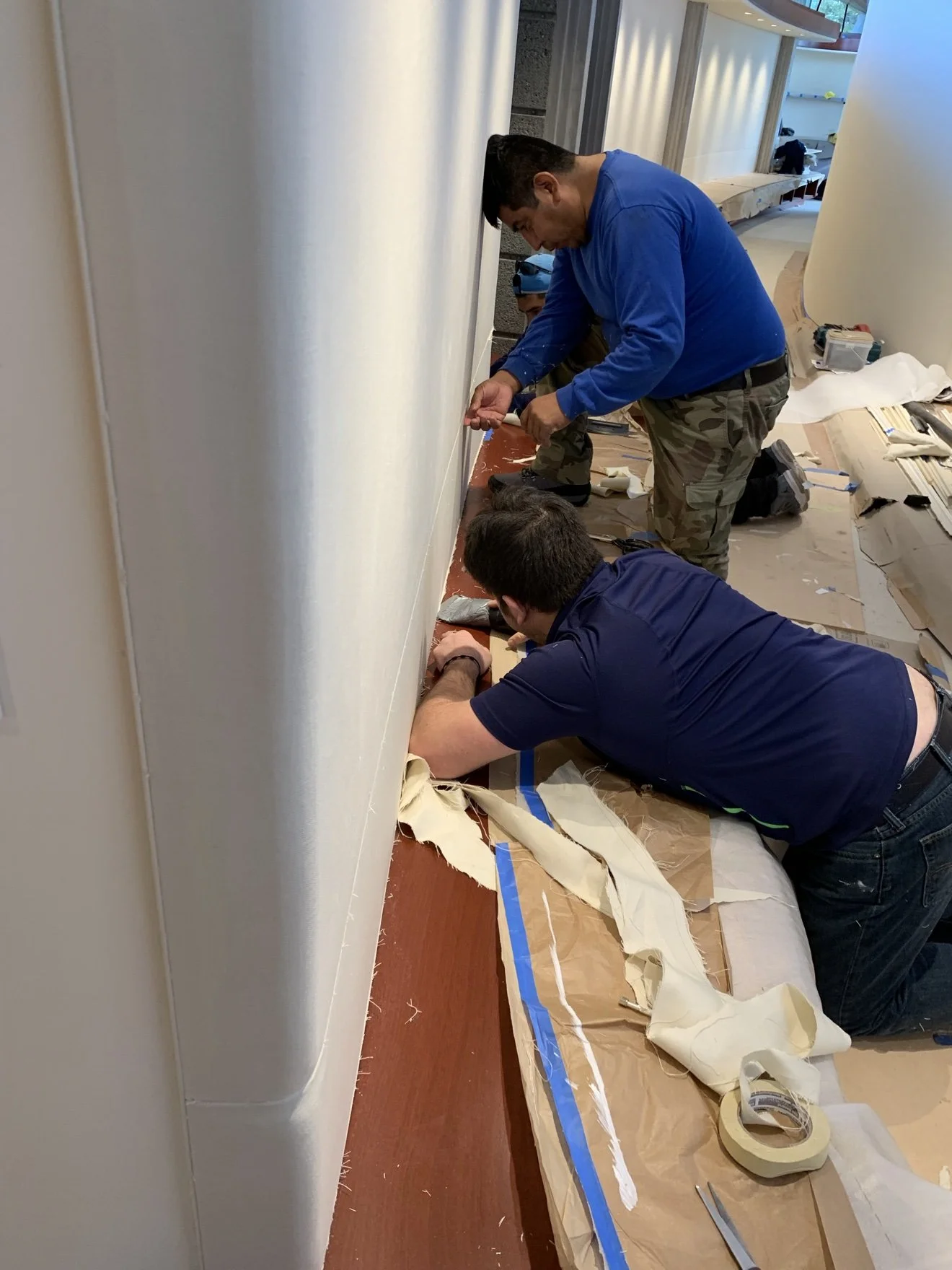 Whisper Wall panel being fitted to a curved surface