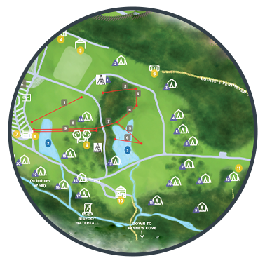 Map of a park with trails, water features, picnic areas, and various recreational facilities, marked with symbols and numbered points of interest.
