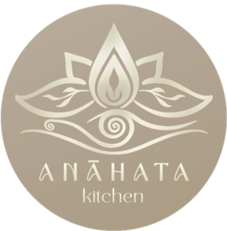 A logo with a stylized lotus flower and a spiral, with the text 'Anahata Kitchen' below it.