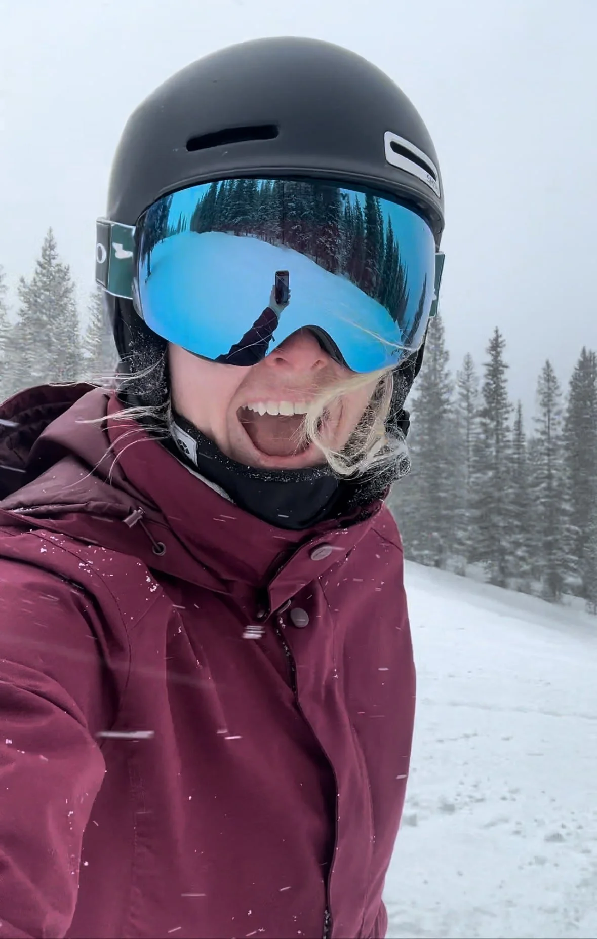 Kat Libby wellness coach in ski wear having fun in snow