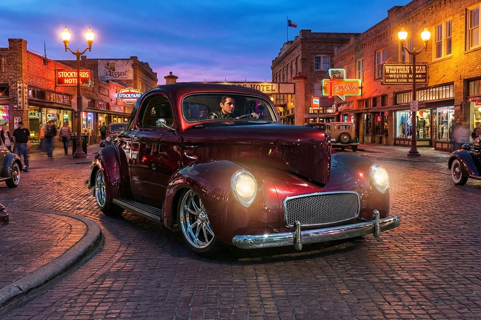 Vintage red car parked on a brick street in front of historic buildings with neon signs, during dusk, in a lively downtown area.