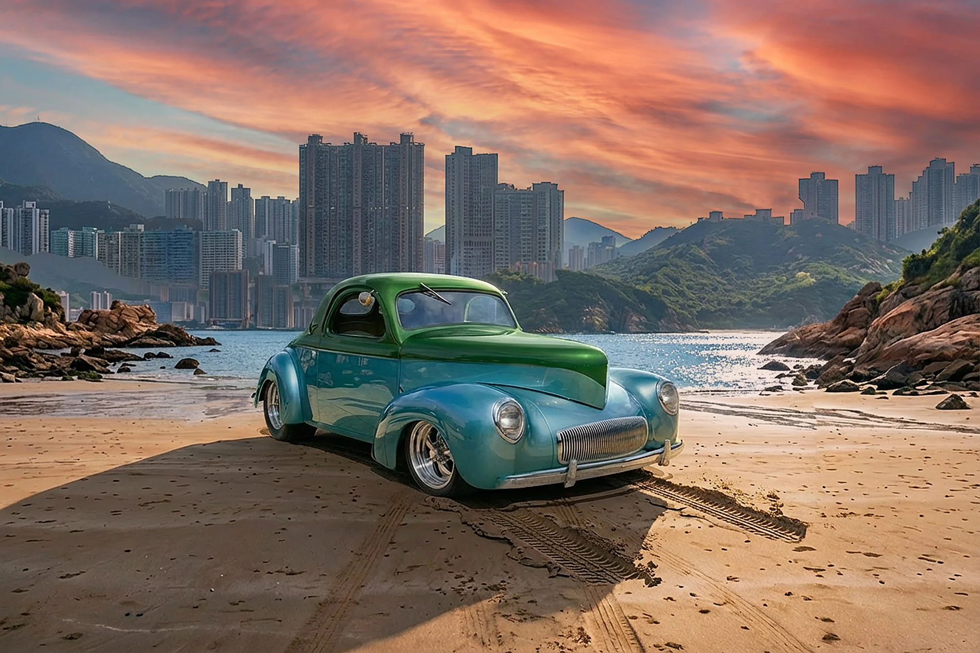 A vintage turquoise and green car parked on a sandy beach with tire tracks, against a backdrop of a city skyline with tall buildings, mountainous terrain, and a colorful sunset sky.