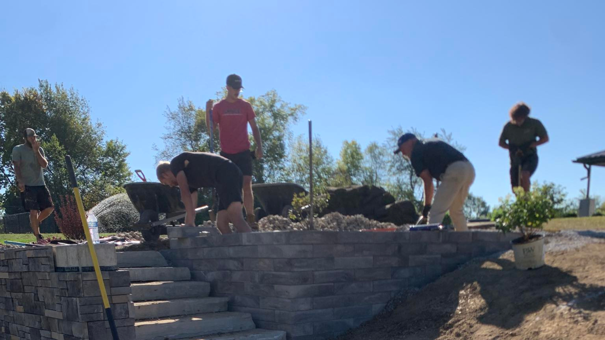 Hard work happening at Eagle eye landscaping building a retainer wall