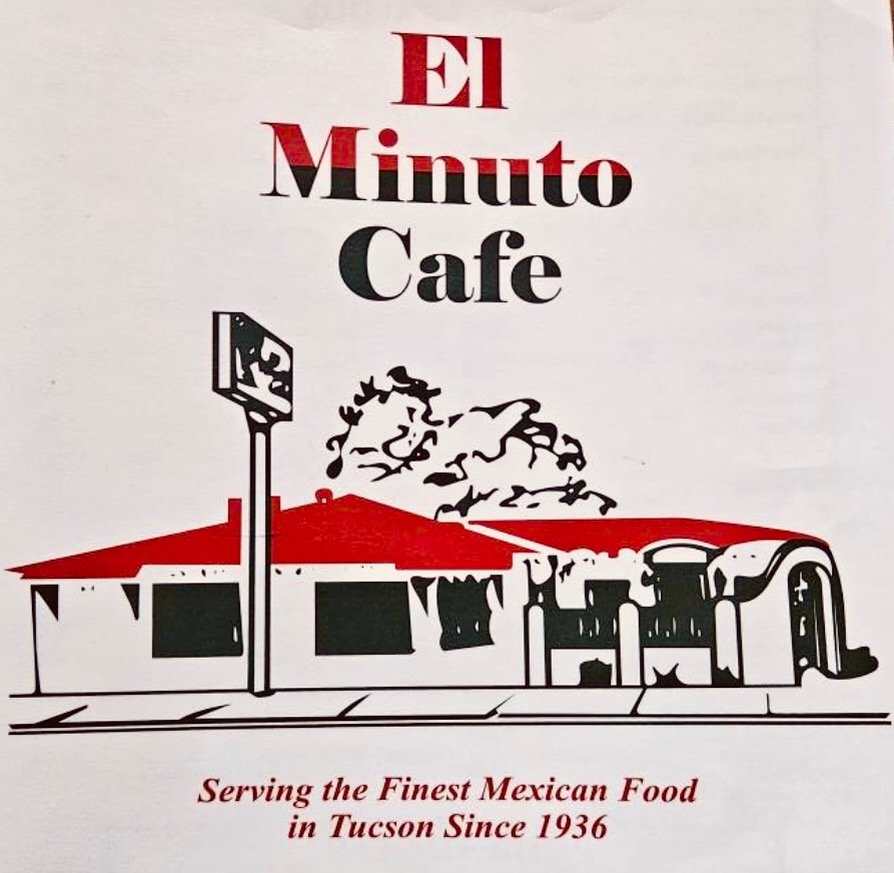 Close-up of dry, yellow palm fronds with sunlight casting shadows on a wall.