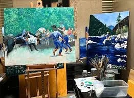 Black and white photo of long, slender grass leaves growing from the base of a tree or shrub.