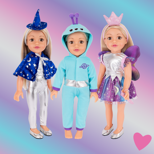 Three DesignaFriend 18 inch dolls wearing a witch outfit, an alien all in one outfit, and a fairy princess outfit with wings and wand. Displayed on a rainbow gradient background with playful hearts.
