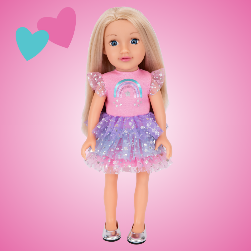 A 14 inch DesignAfriend doll with blonde hair wearing a colourful rainbow dress, displayed on a pink background with playful hearts.
