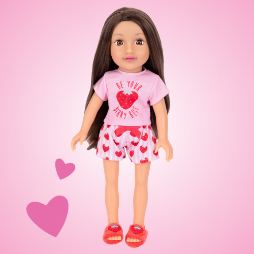 A 14 inch DesignAfriend doll with brunette hair, wearing strawberry themed pyjamas and slippers, displayed on a light pink background with playful hearts.