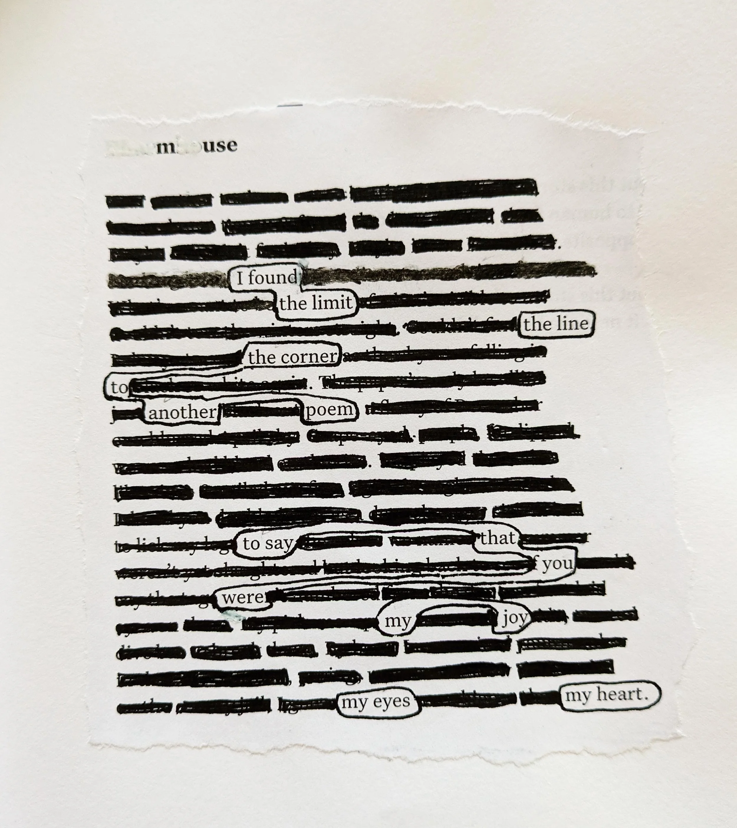 Torn paper with blacked-out text and selected words forming a poem, including words like 'I found the limit', 'the corner', 'poem', 'say', 'you', 'joy', and 'eyes'.