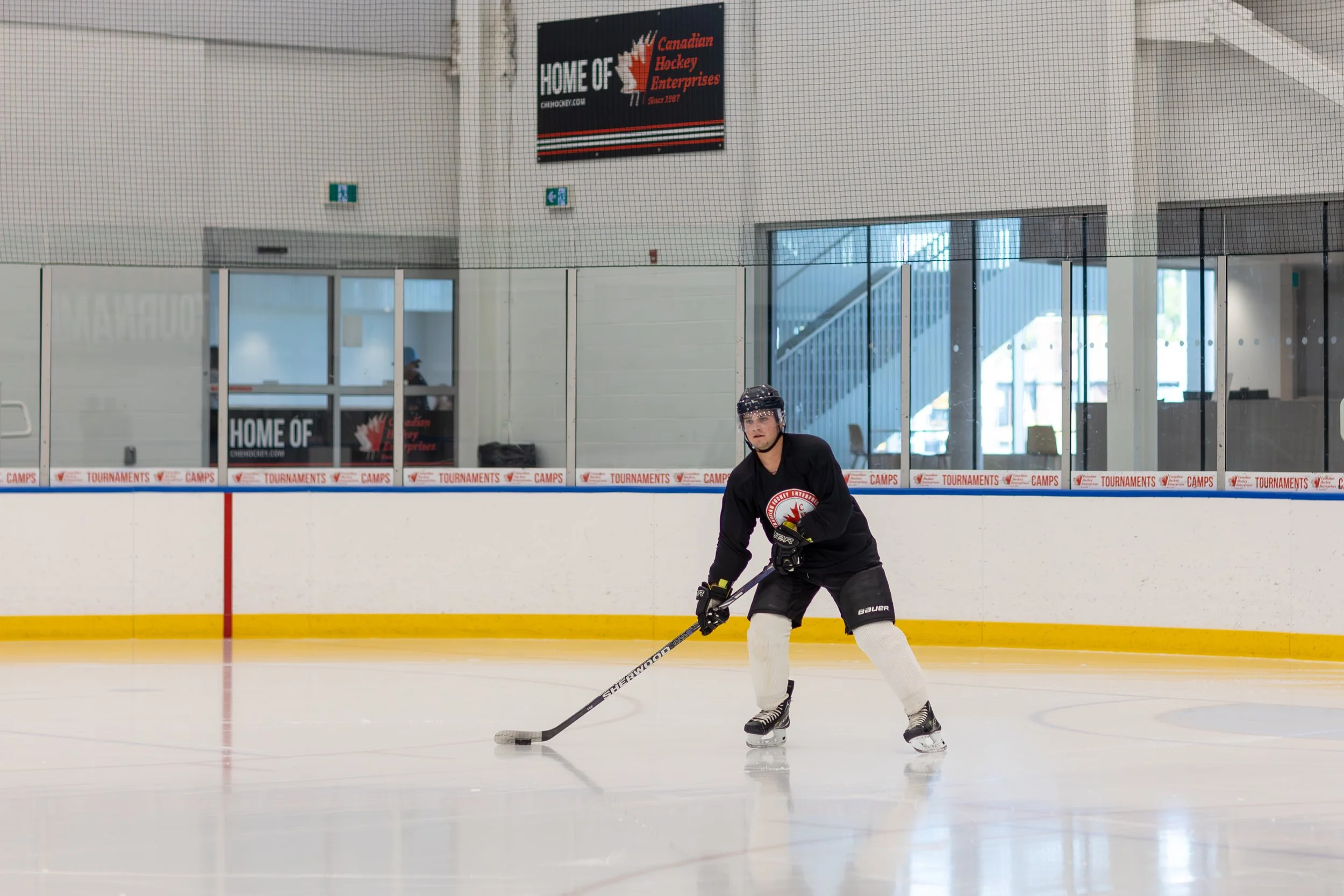 Hockey player practicing on the ice rink during a training session.