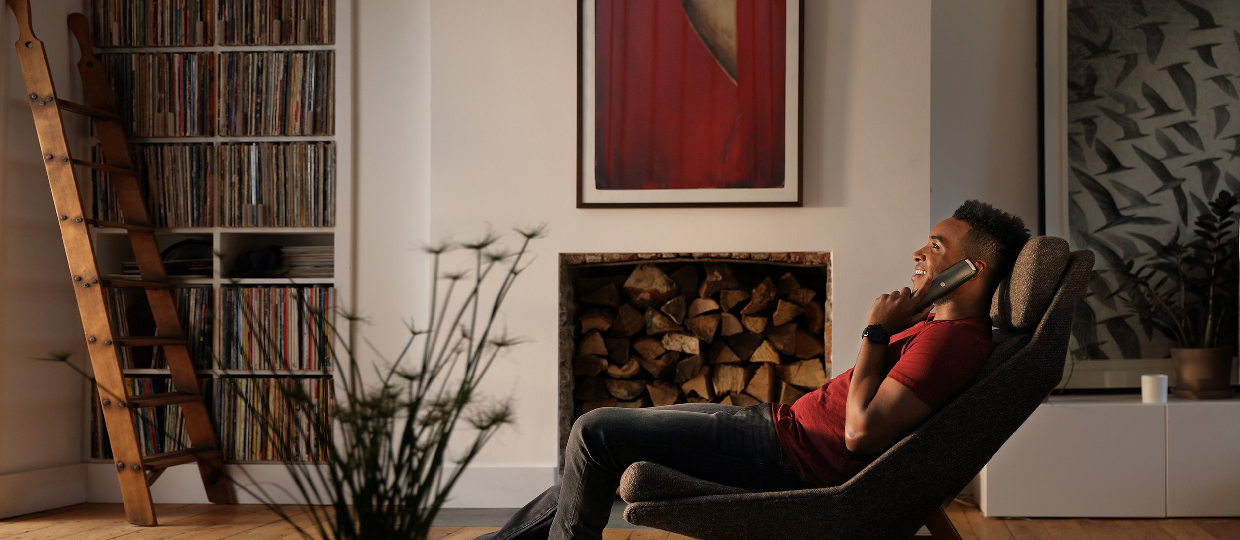 BT man in lounge on phone