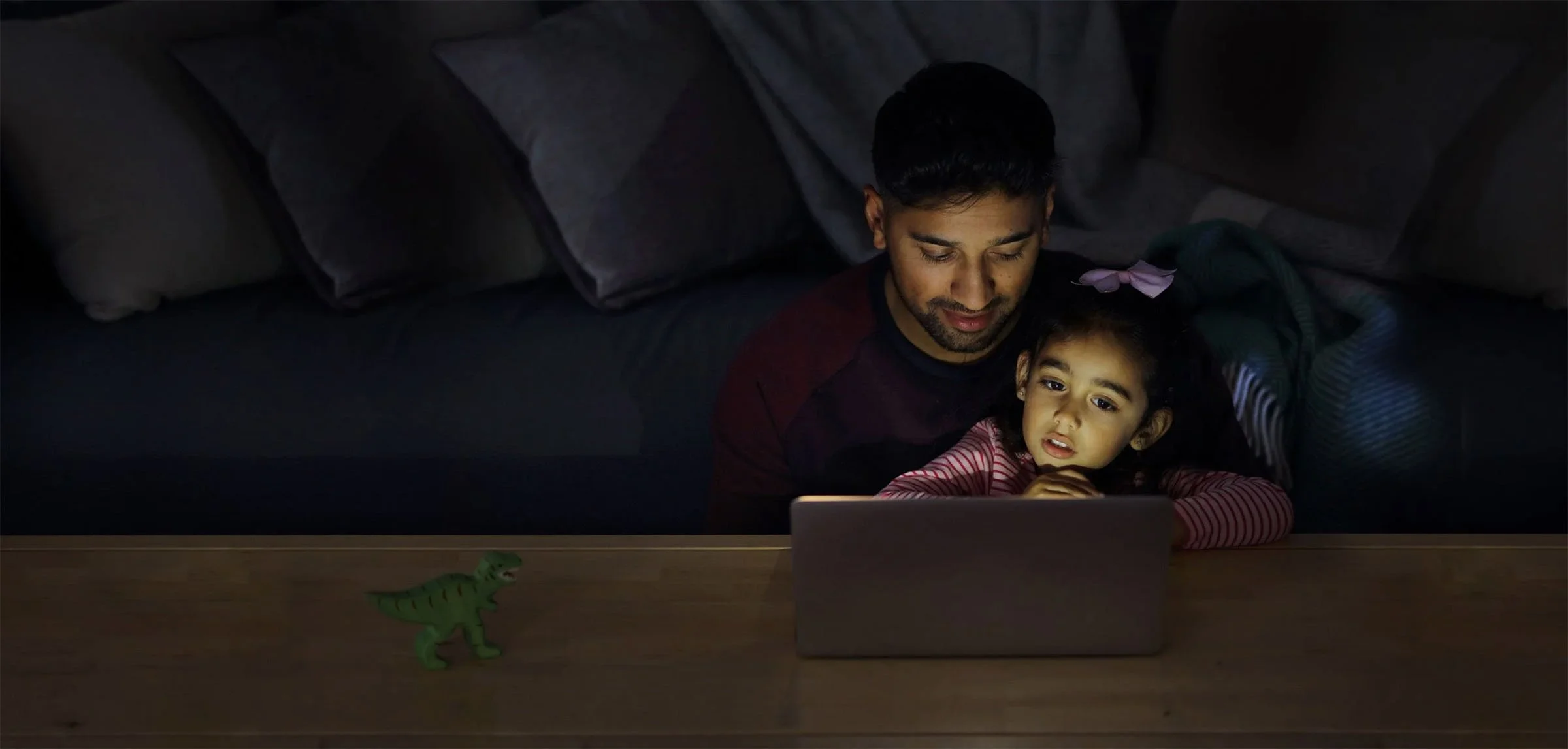 Father and Daughter on laptop using bt broadband, shot by David Burton Photography
