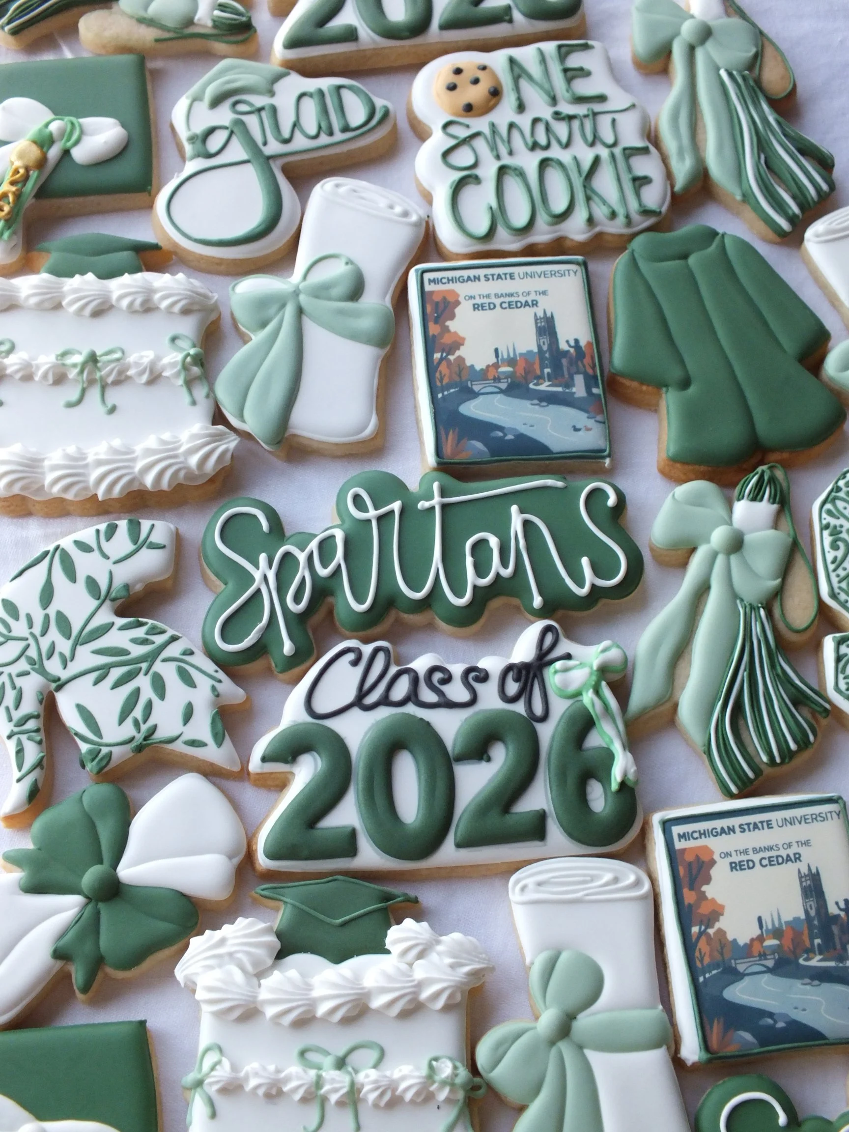 Michigan State University themed Graduation Cookies. Fresh and Delicious MSU cookies