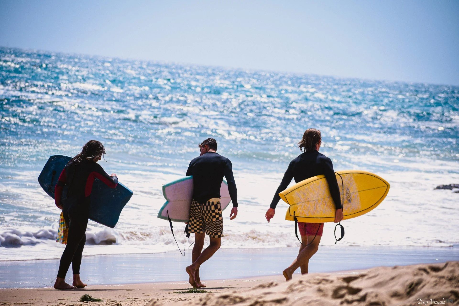 Surfers in Cali