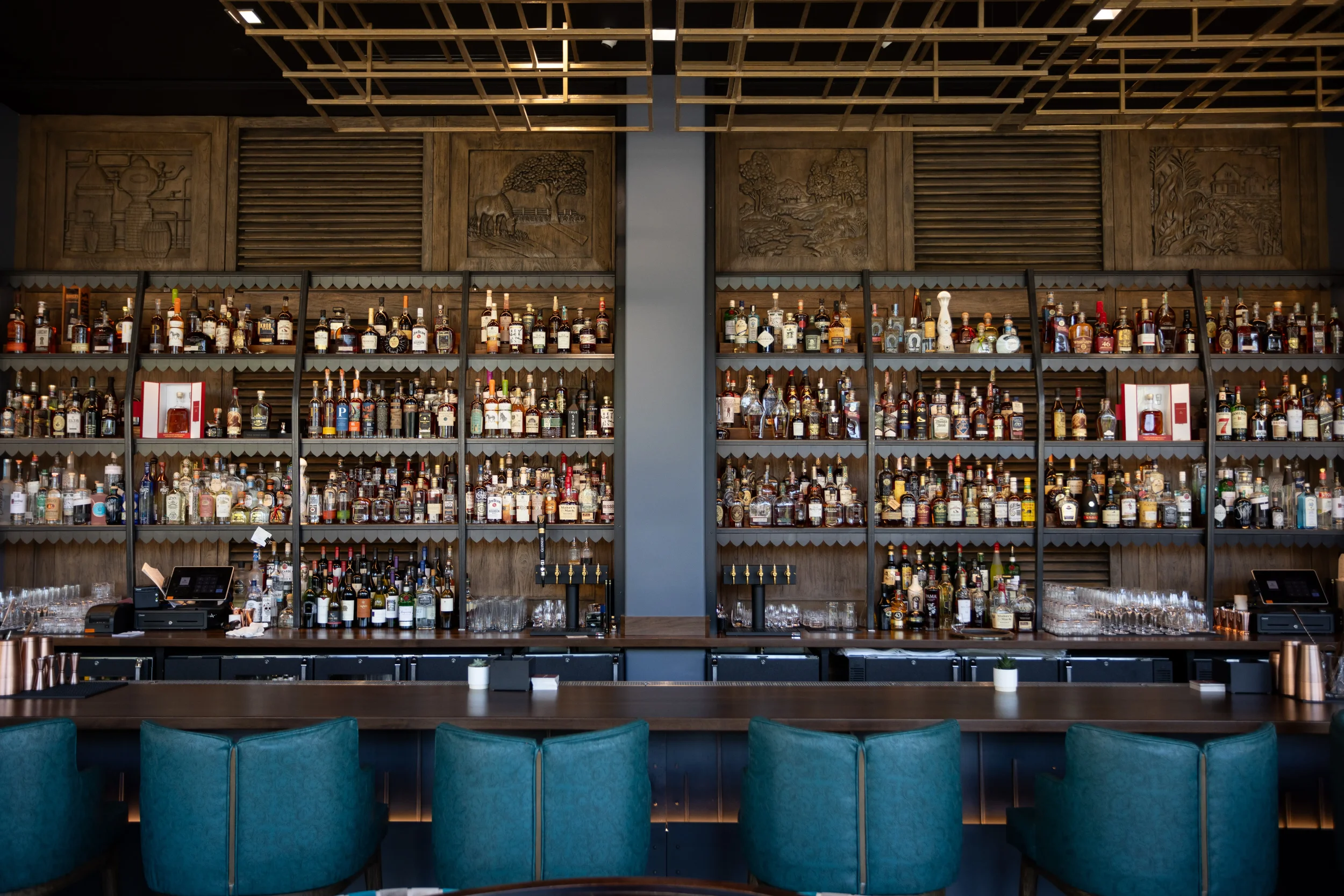 An Image of Hotel Bourre Bonne Backbar custom fabricated metal dislay shelving.