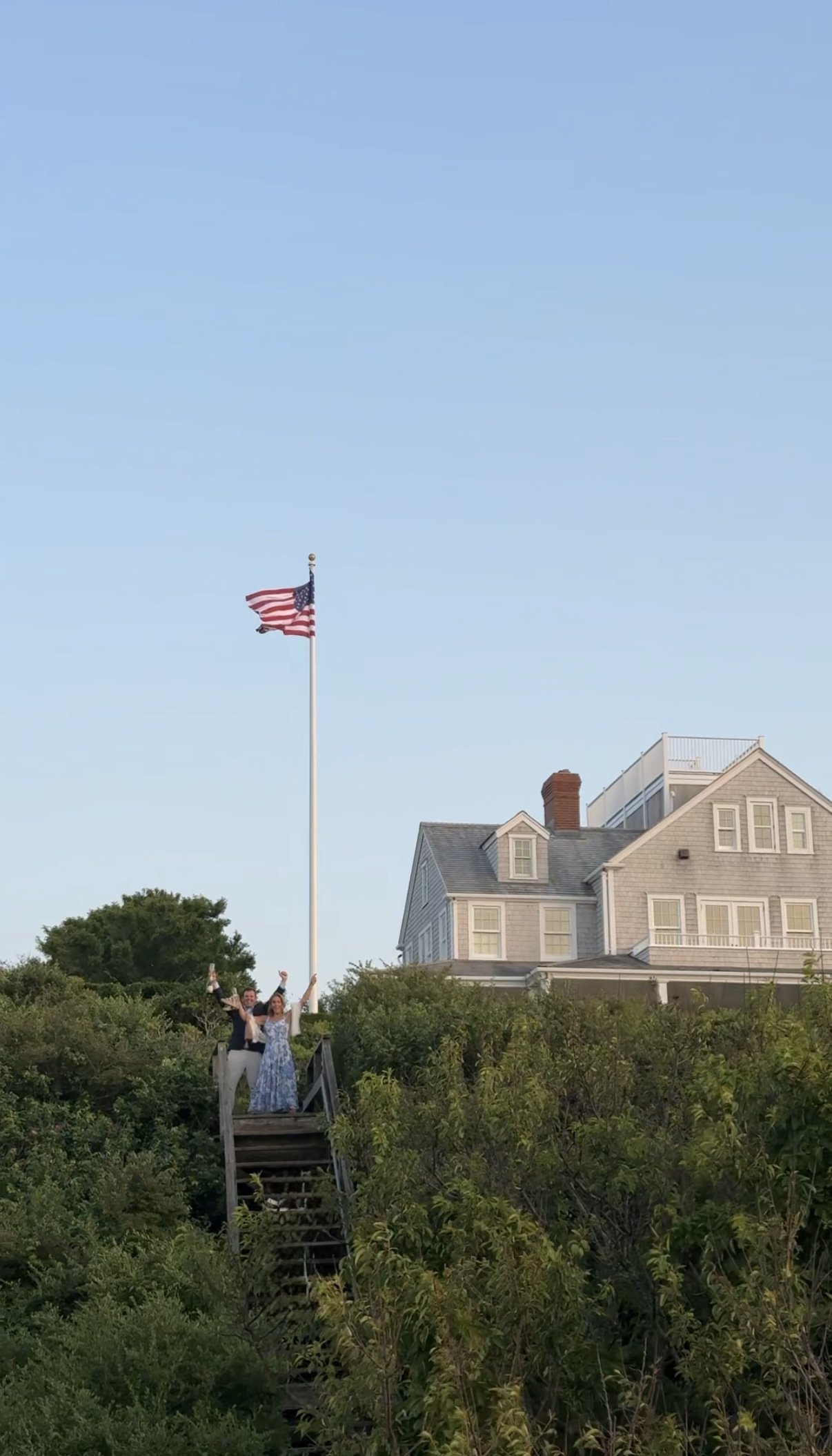 Bride and groom sharing first kiss at luxury Nantucket wedding ceremony – Vogel Wedding Content Creator Intimate garden party wedding reception in Siasconset, Nantucket with coastal florals – Vogel Wedding Content