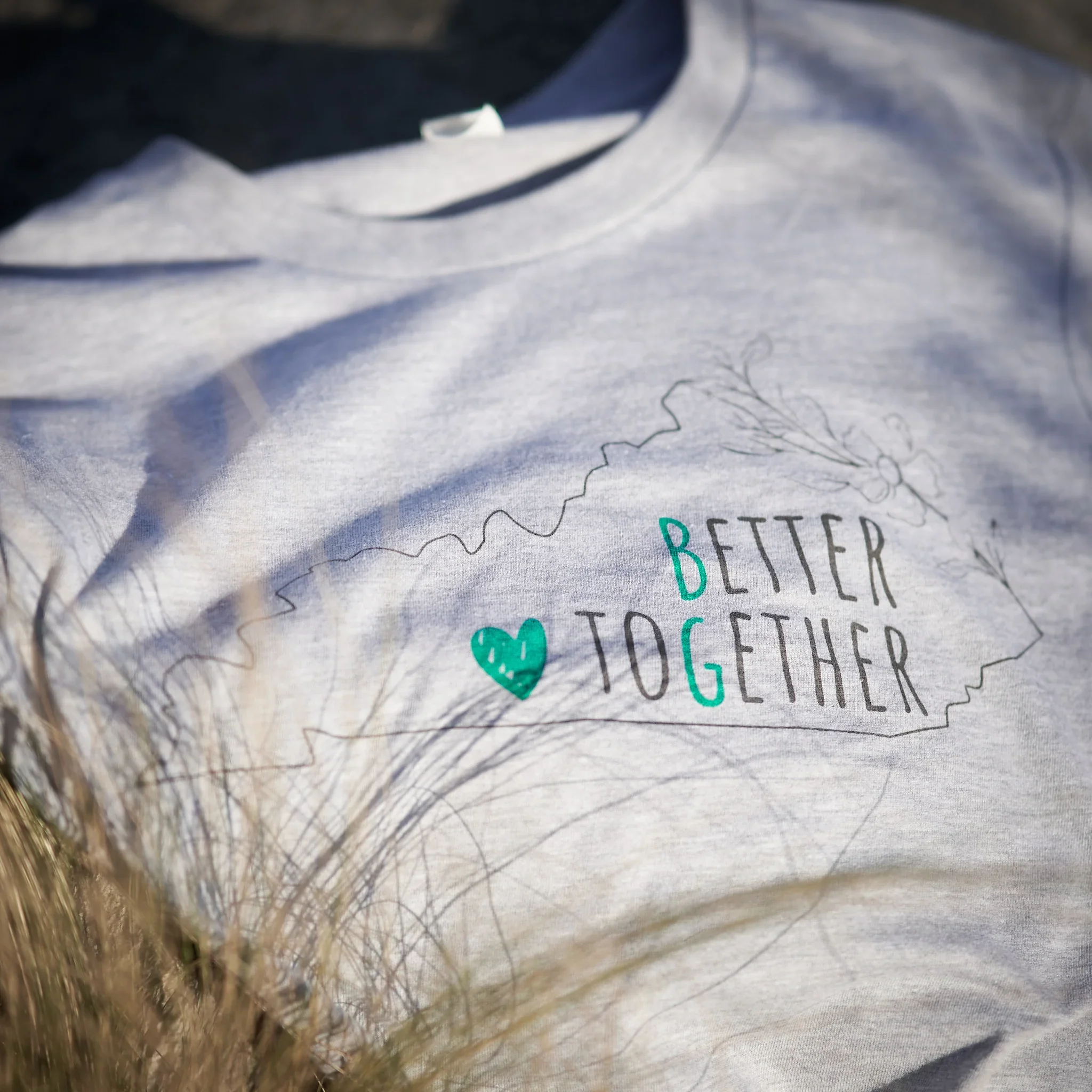 T-shirt featuring the Kentucky state outline in benefit of Flowers Around the Corner, a local business in Bowling Green, KY.