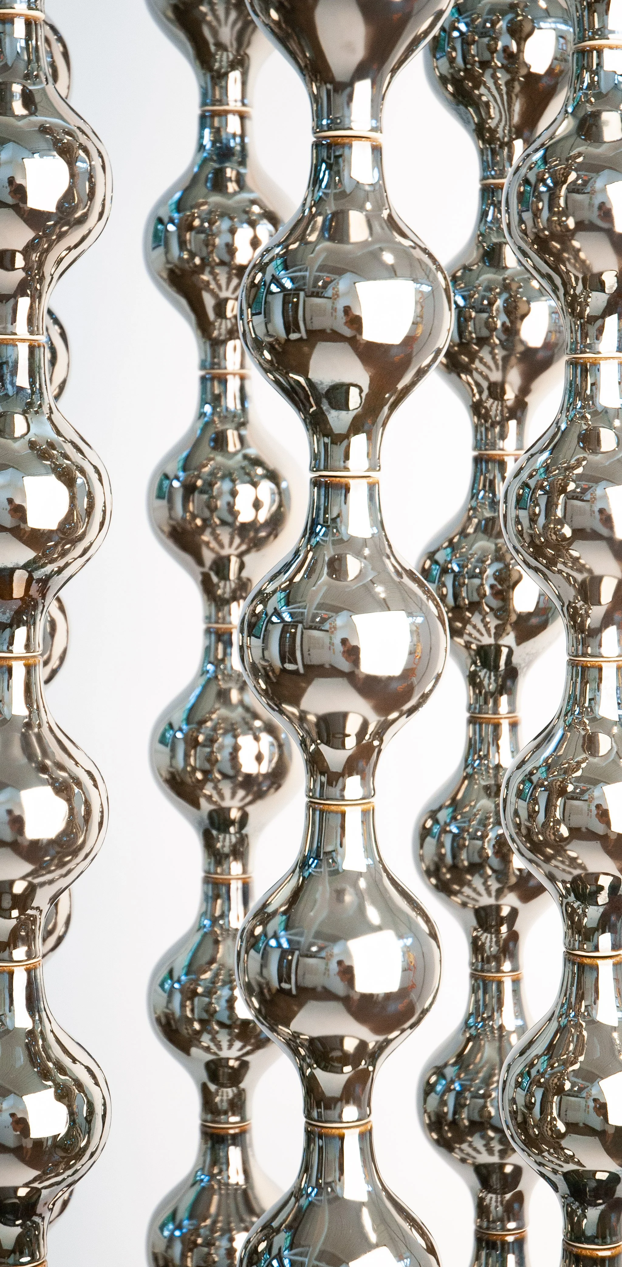 Happening Circle, suspended ceramic composition in platinum
