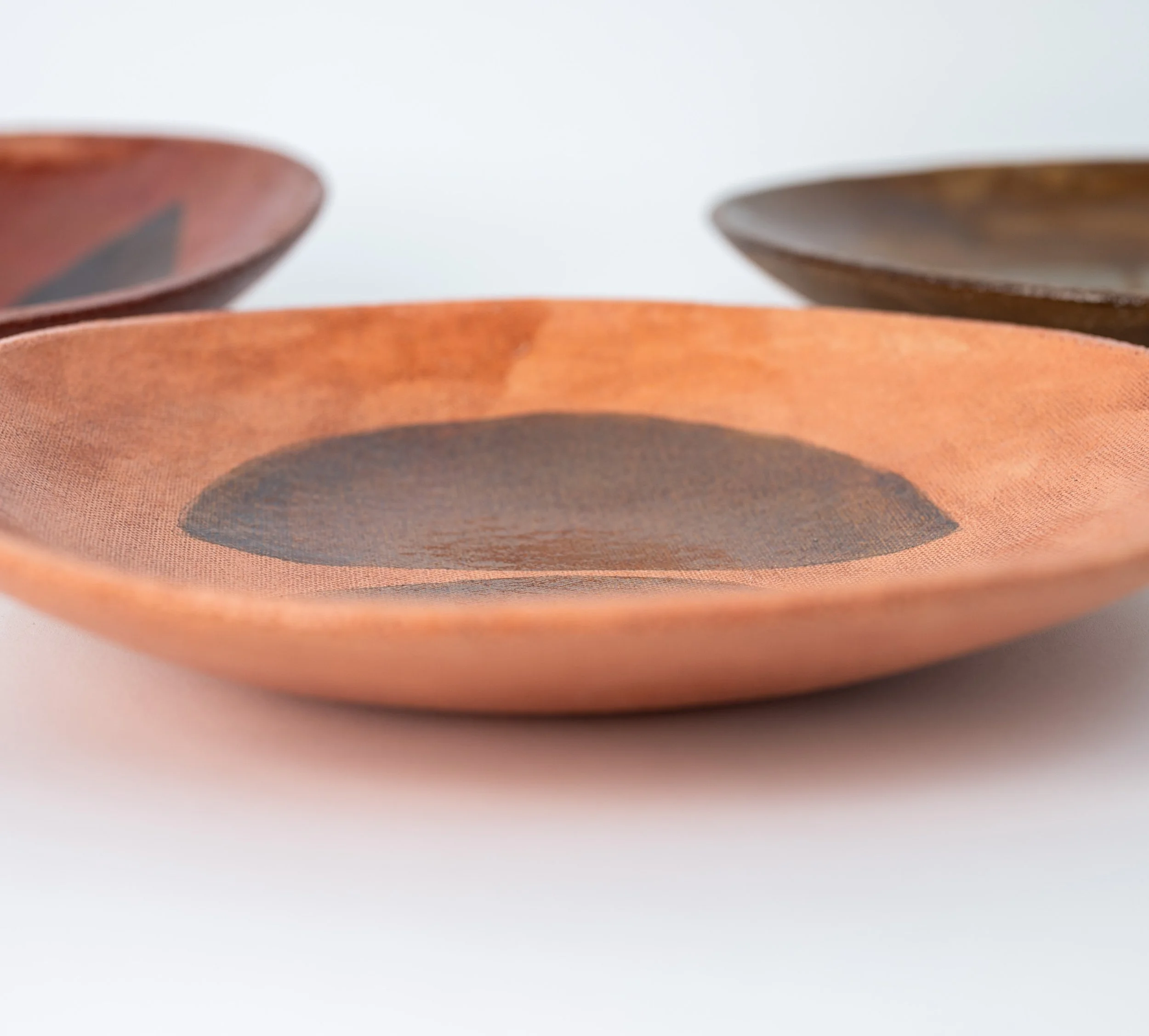 Geometria Bowls seen from the side, glazed stoneware bowls by Jim Schatz