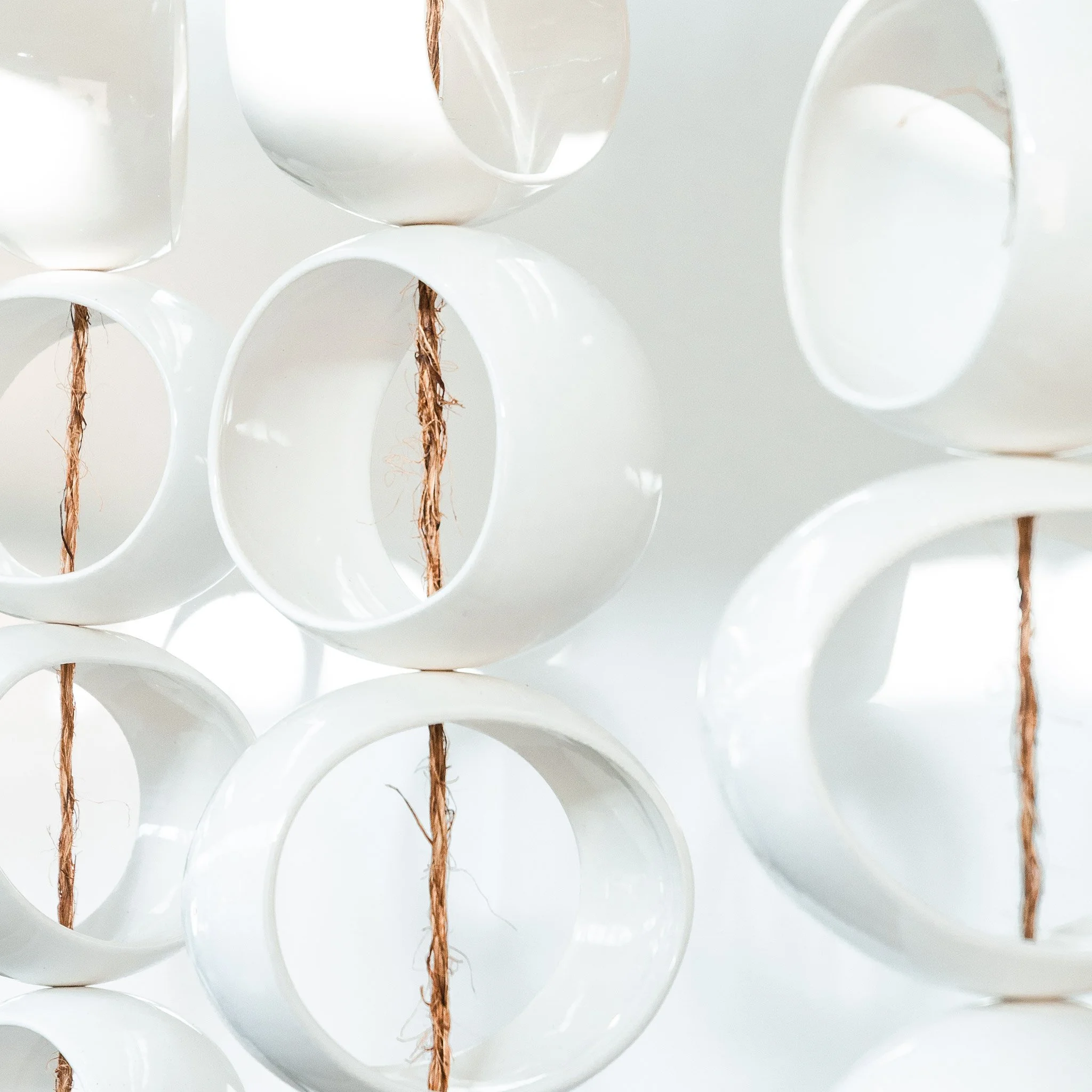 Side view of White Orb Sculpture showing the imperfect ellipse forms
