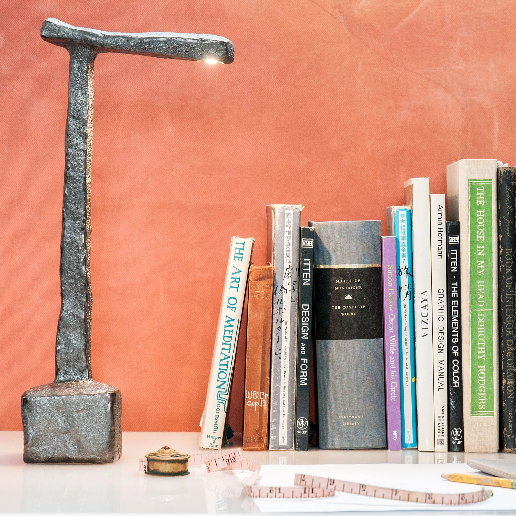 Desk Lamp A17-1 by Jim Schatz — in scale on a desk with book