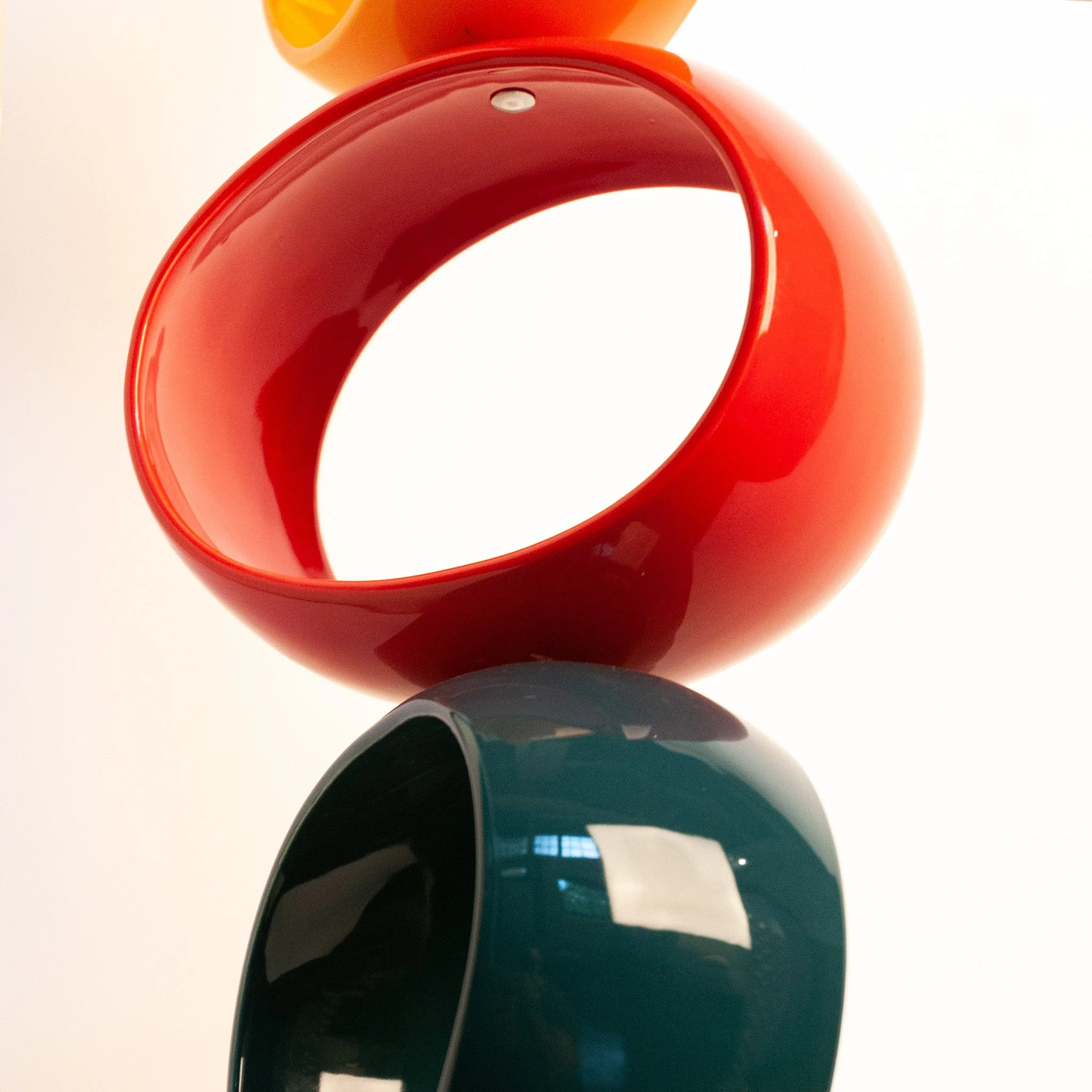 Stainless steel grommet detail connecting two orbs