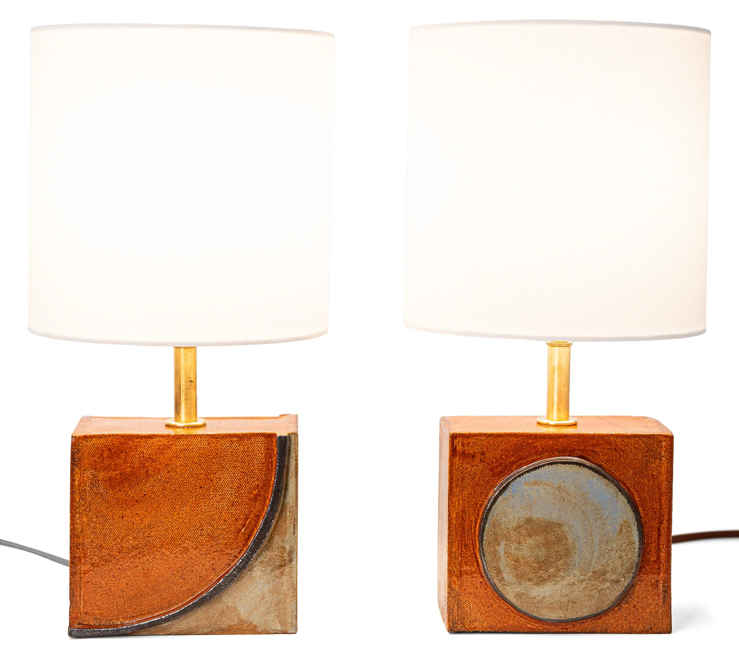 Geometria Brick Lamps, the quarter-arc lamp and the disc lamp side by side, by Jim Schatz.