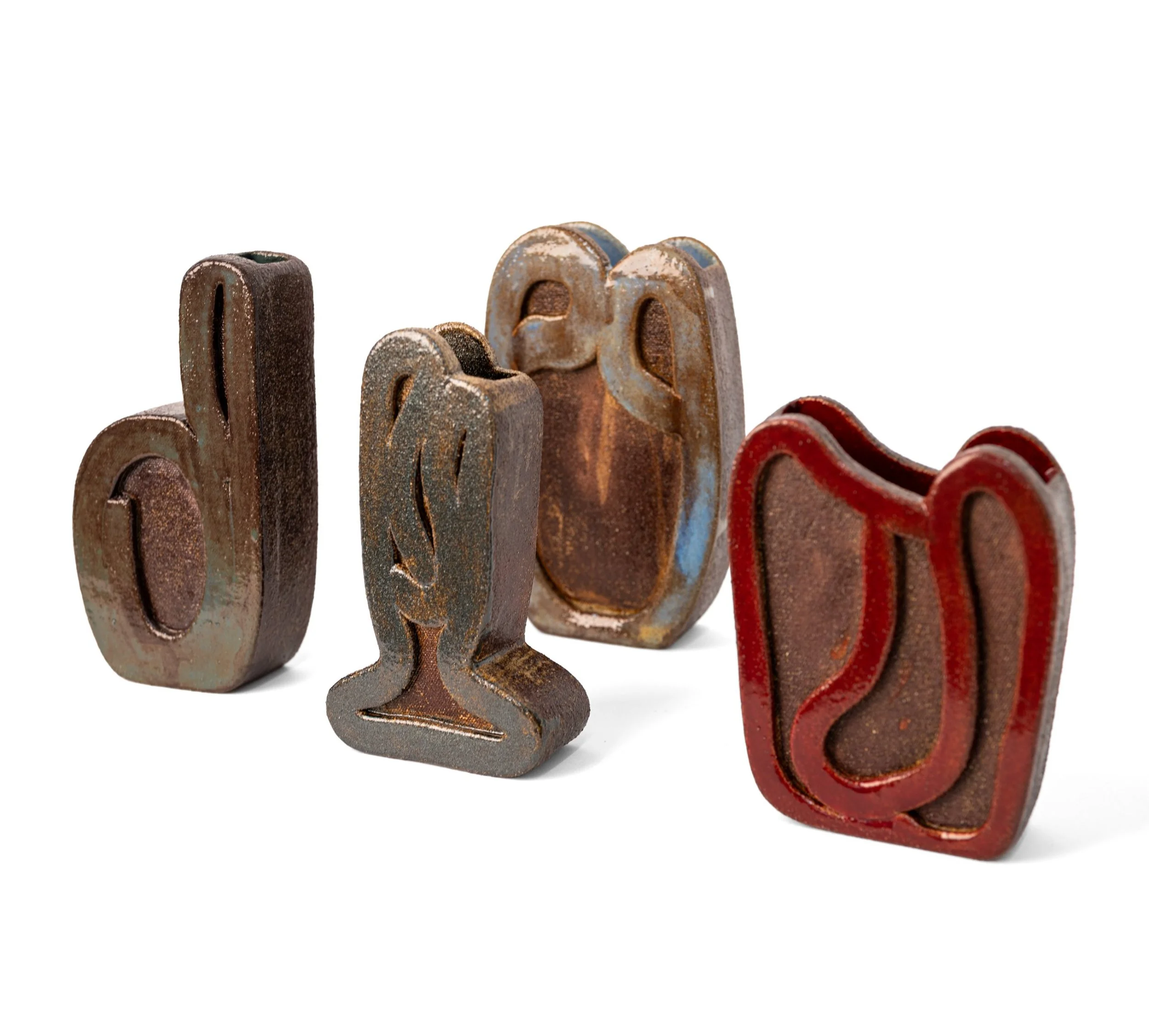 Ribbon Vessels, all four vessels together, flat stoneware forms drawn with raised glazed ribbons of clay, by Jim Schatz.