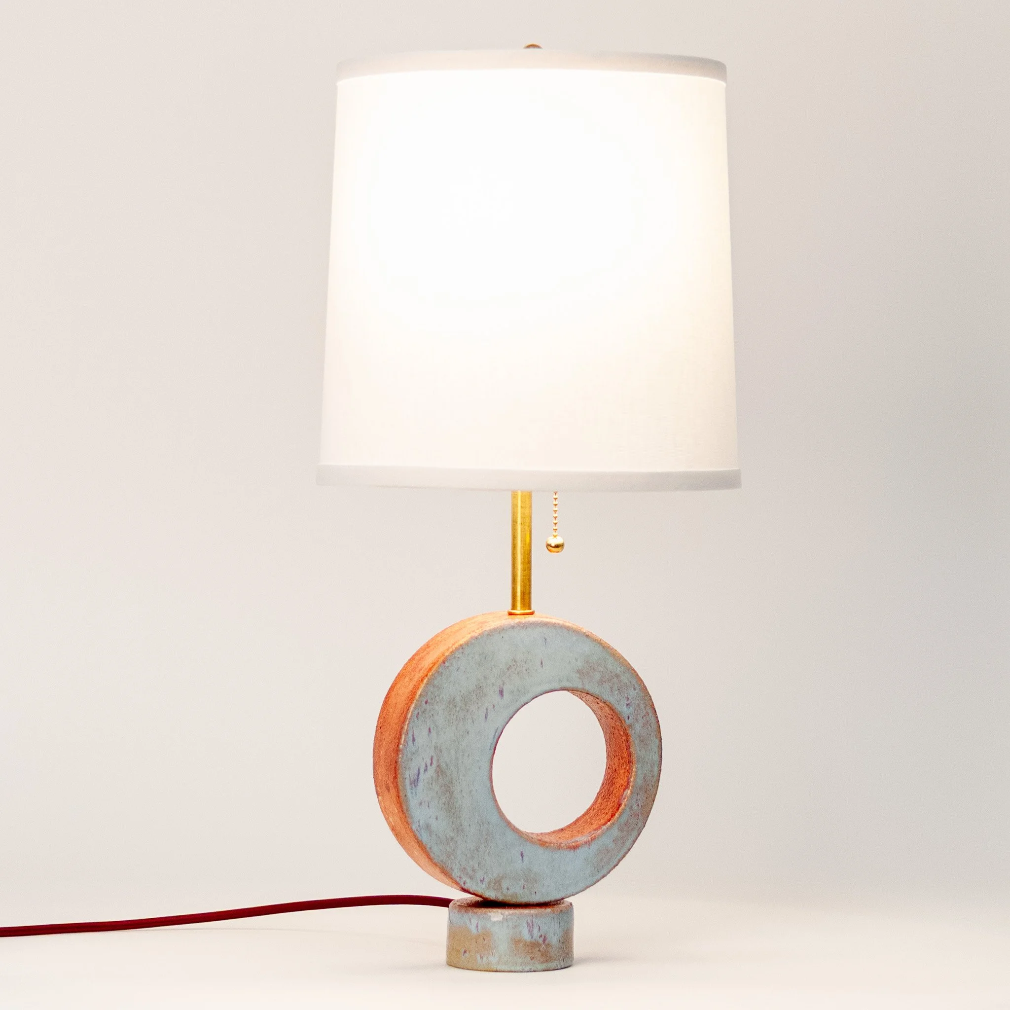 Radius Table Lamp 3 by Jim Schatz — front with linen shade