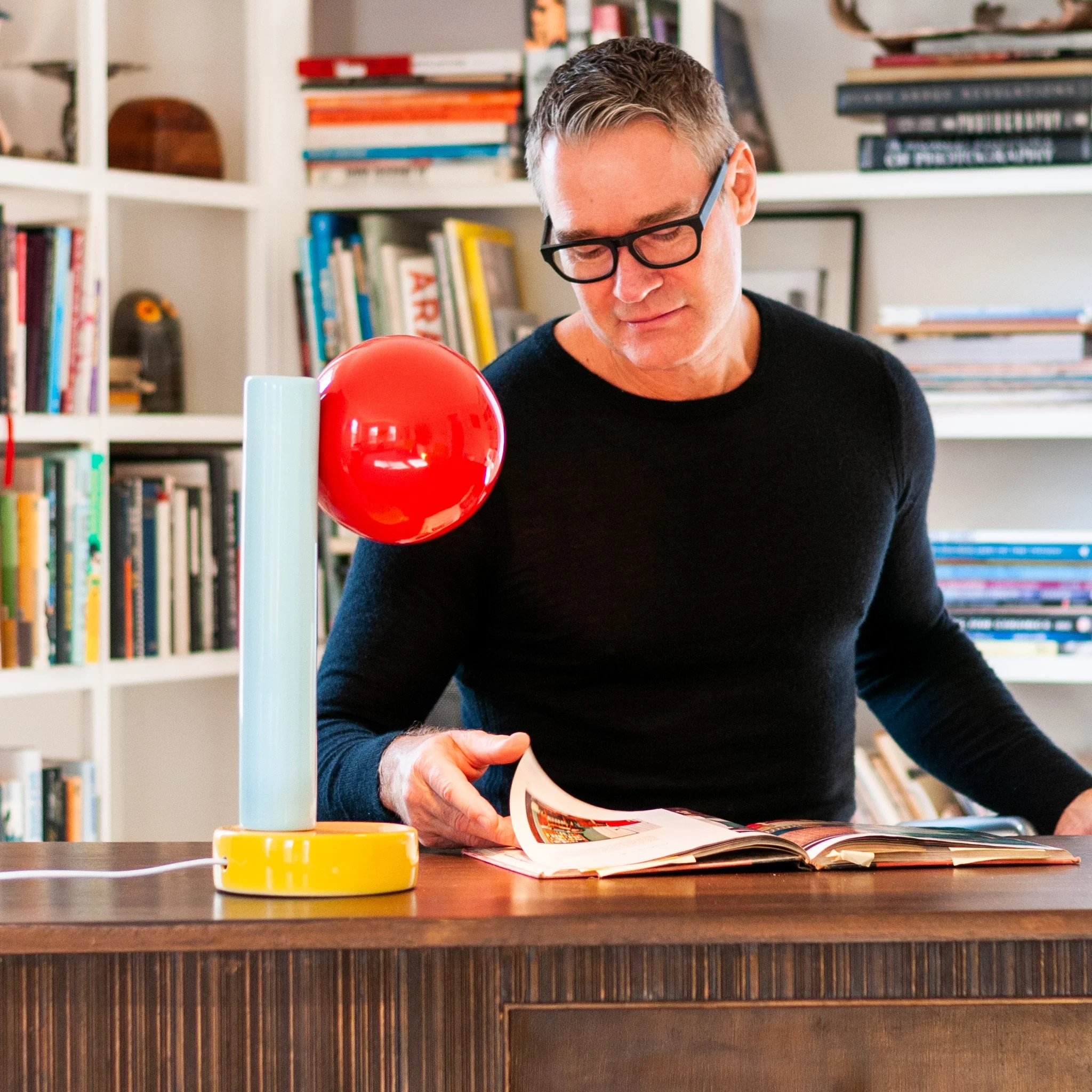 Spot On Desk Lamp by Jim Schatz — in scale with artist at desk