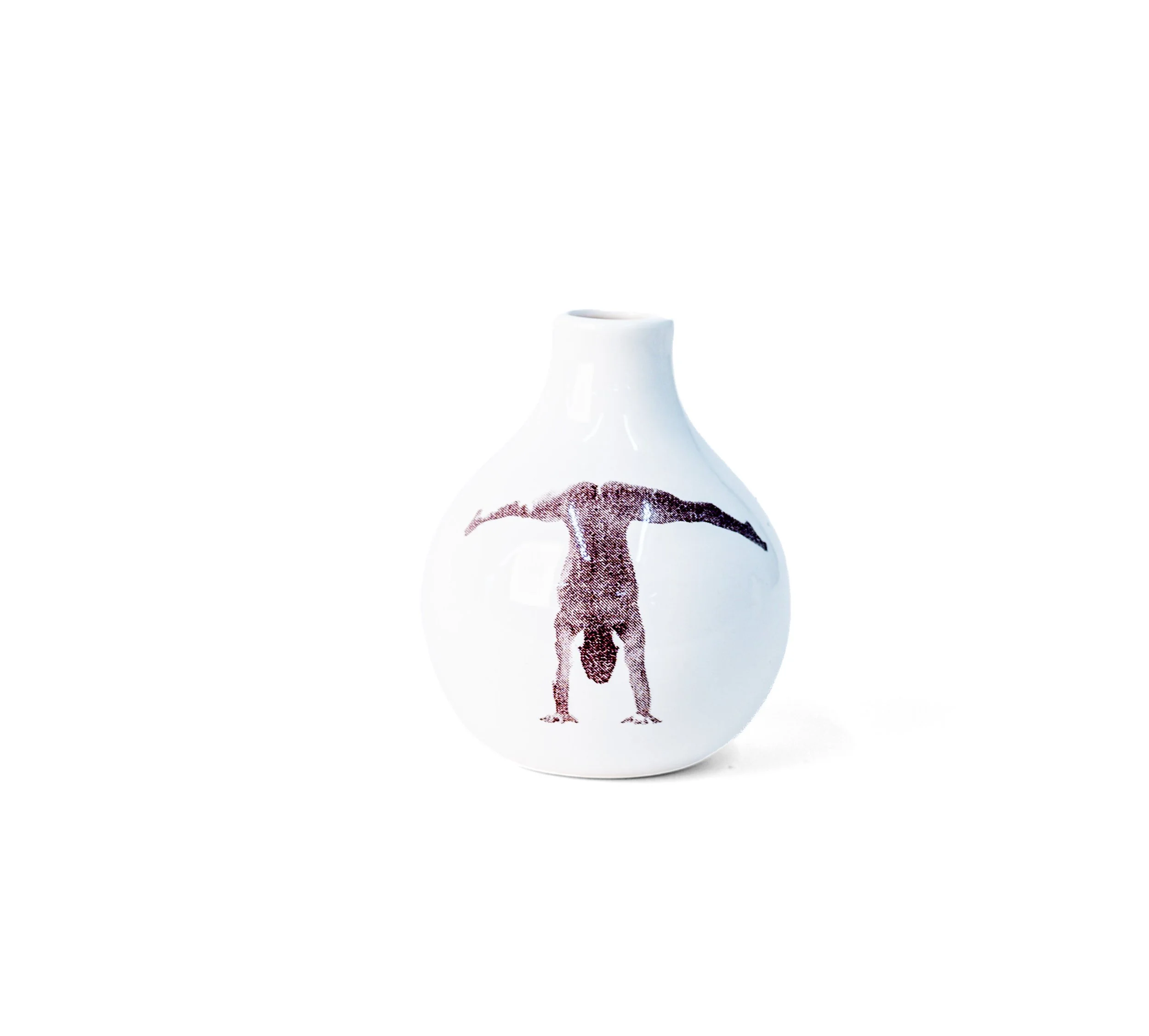 White porcelain bud vase with a handstand figure, legs extended — Gestures Bud Vase 2 by Jim Schatz.
