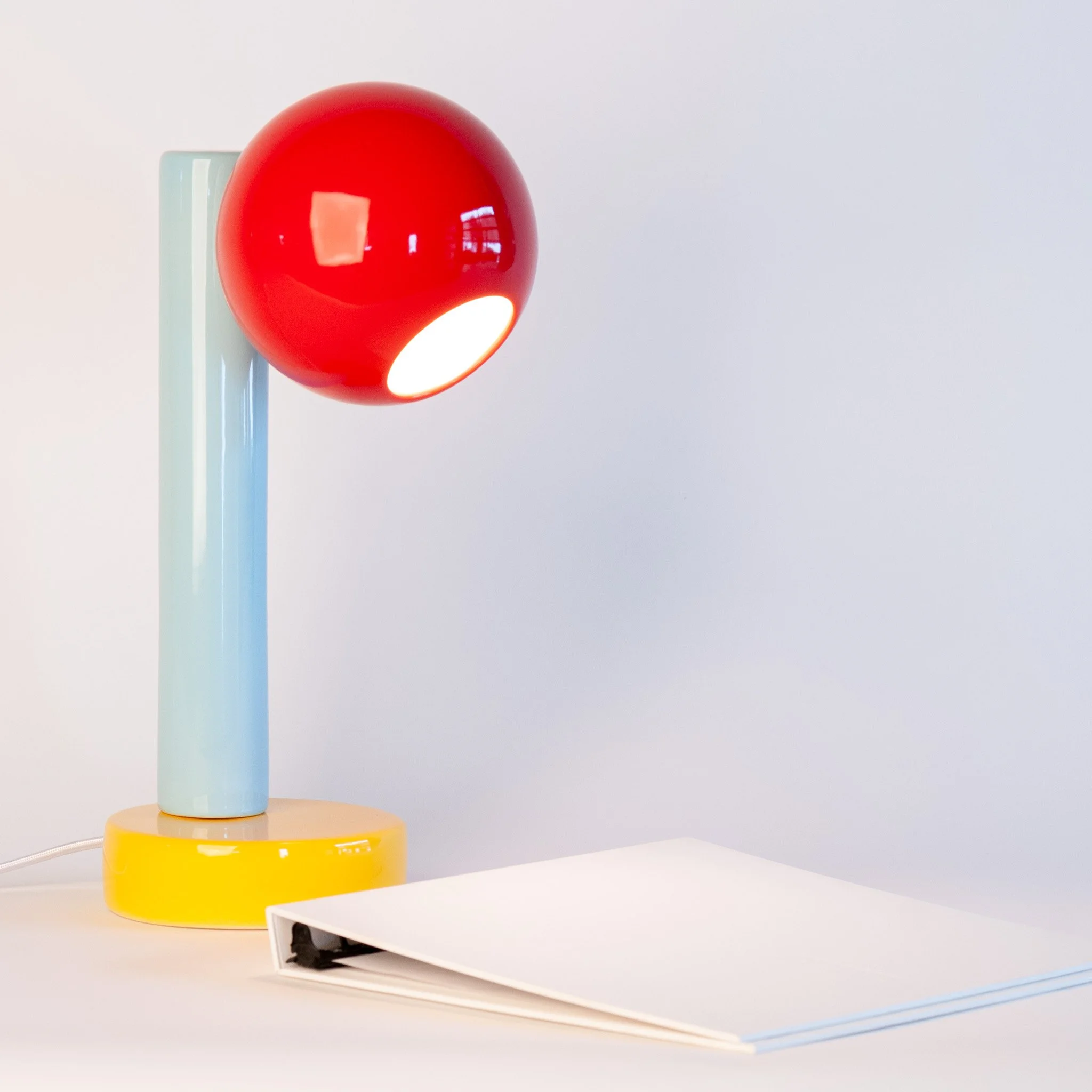 Spot On Desk Lamp in Sumac Red, Light Aqua, Goldenrod Yellow by Jim Schatz — angle