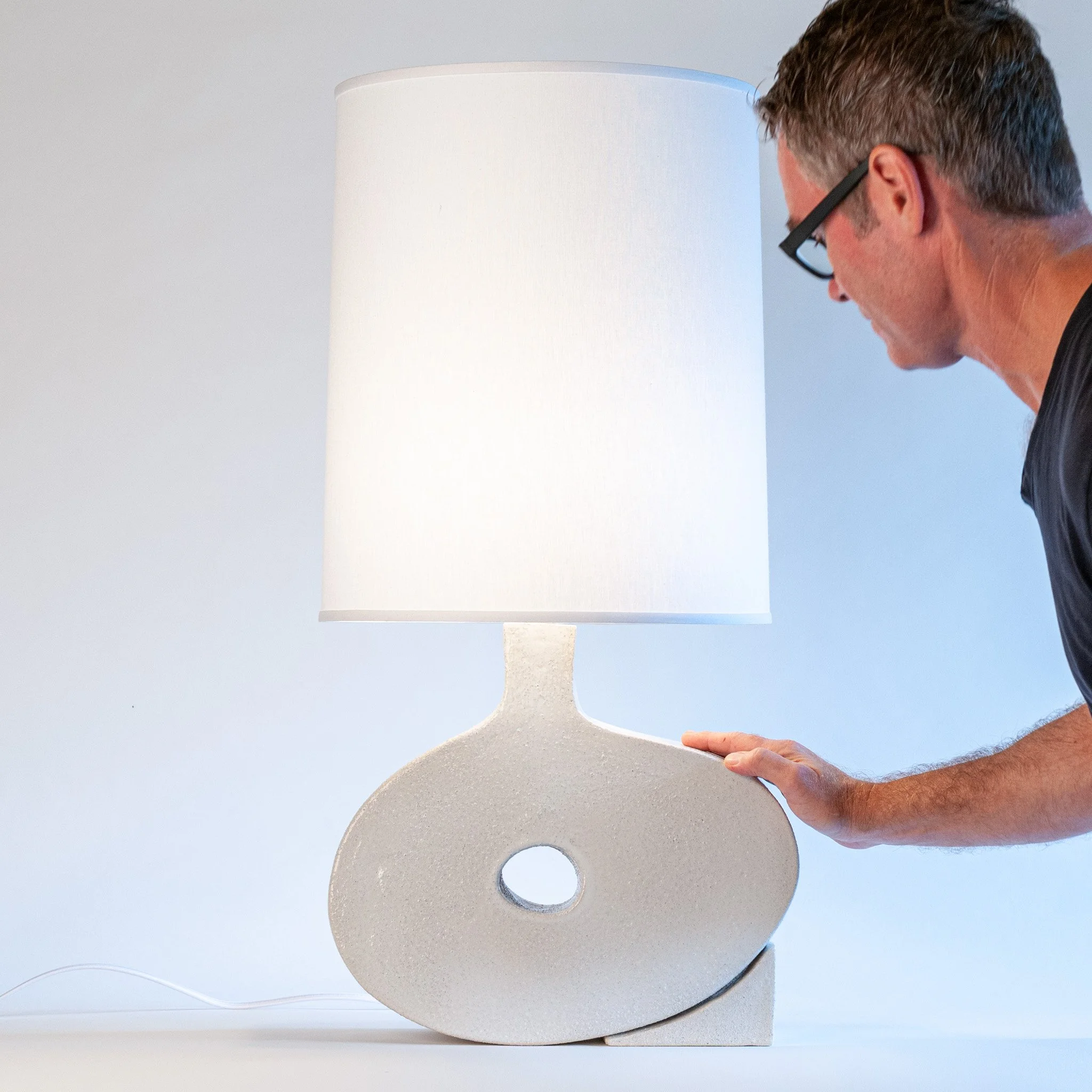 Wedge Table Lamp by Jim Schatz — in scale with artist
