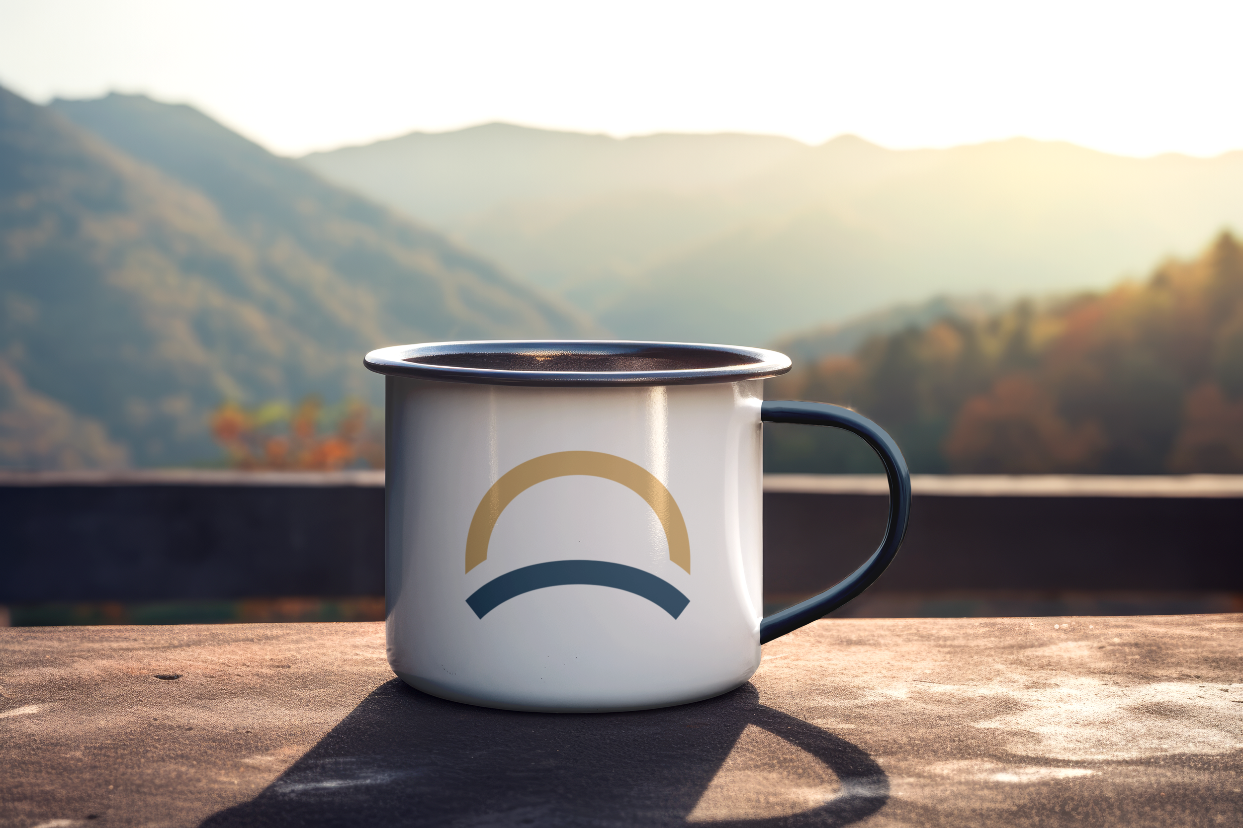 Enamel mug with a sad face design on a wooden surface, with mountain landscape and sunlight in the background.