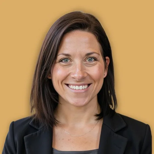 Portrait of a woman with dark hair, glasses, wearing a dark blazer and light shirt, smiling against a gold background.