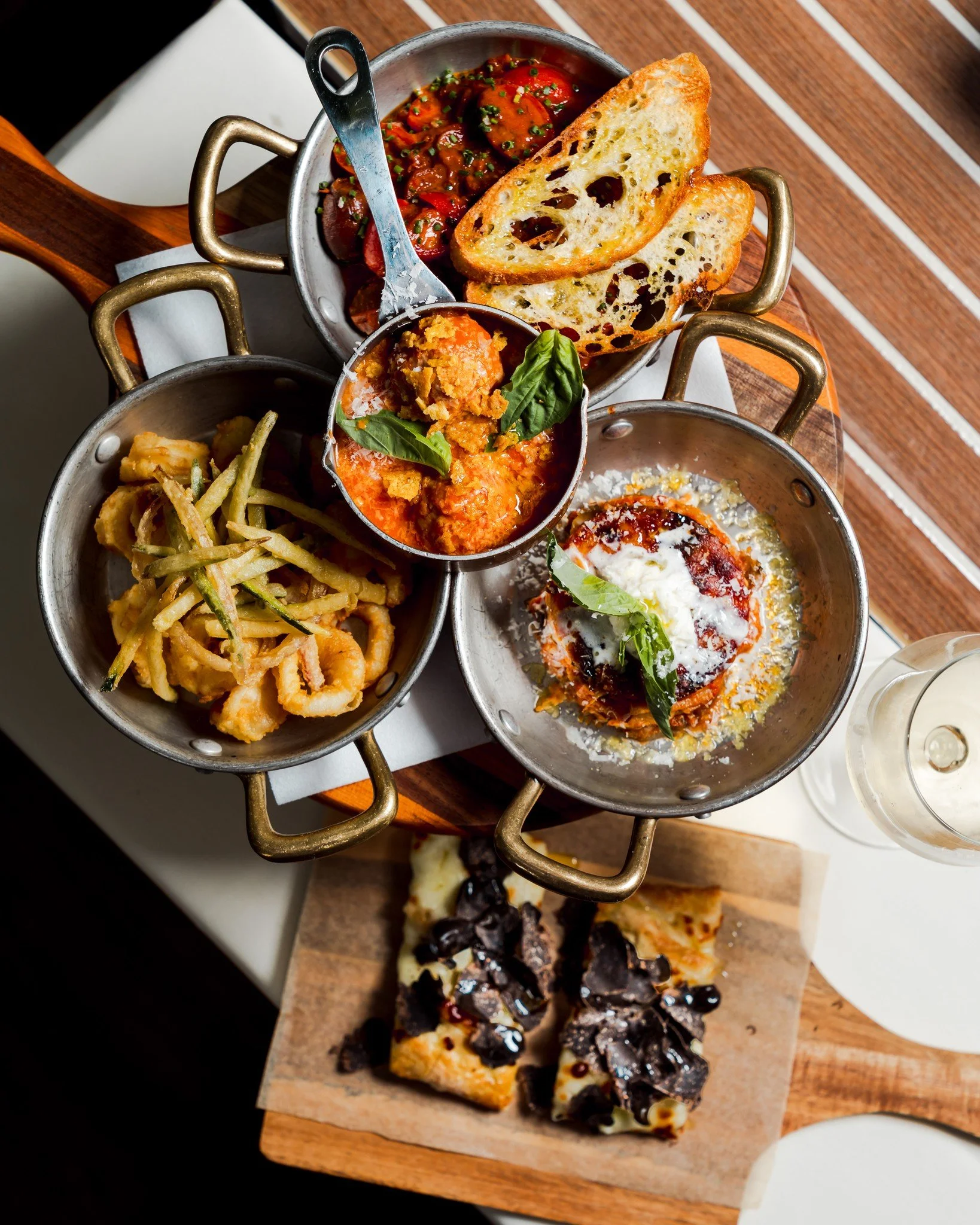 Our new Family-Style Appetizer Plate is now available, $25 per person, featuring a rotating selection of seasonal small plates crafted by our chefs each week. Perfect for sharing. Designed to surprise.