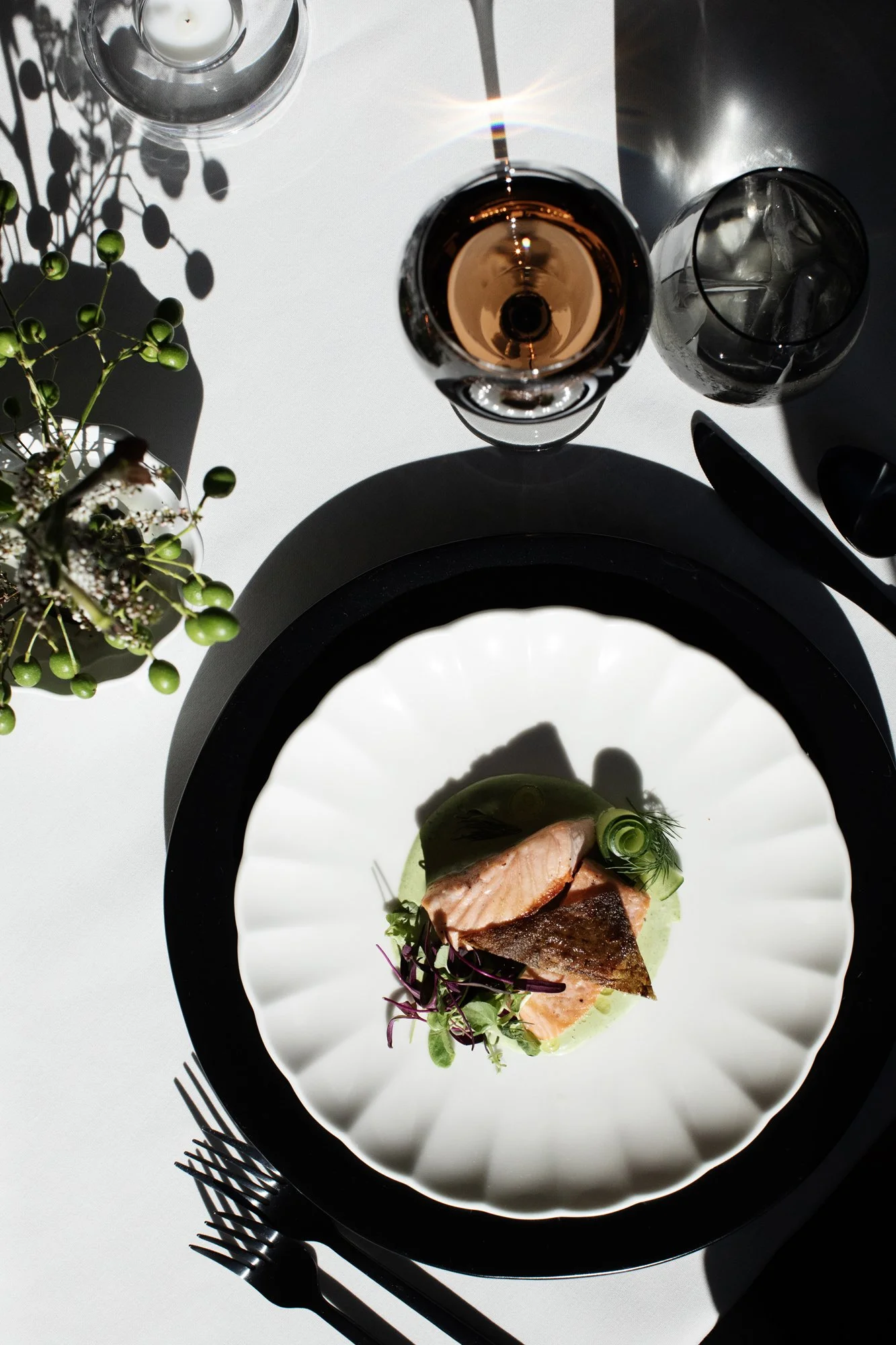 Plated pan-seared salmon with cucumber yogurt sauce, dill, and microgreens at a wedding reception — Food Gallery Catering Minneapolis
