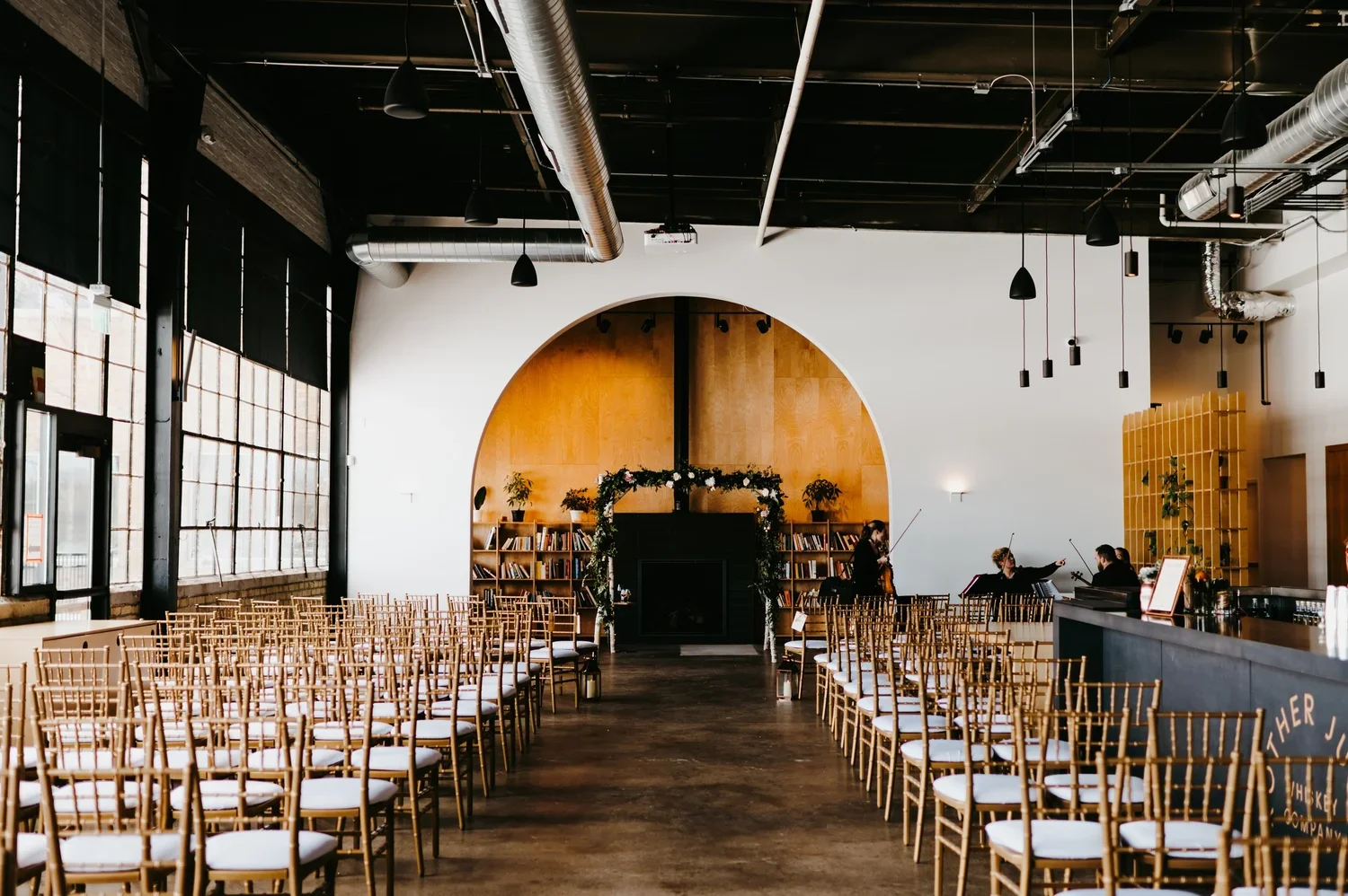 Indoor ceremony setup at Brother Justus Whiskey Co., one of the best winter wedding venues in Minneapolis, Minnesota