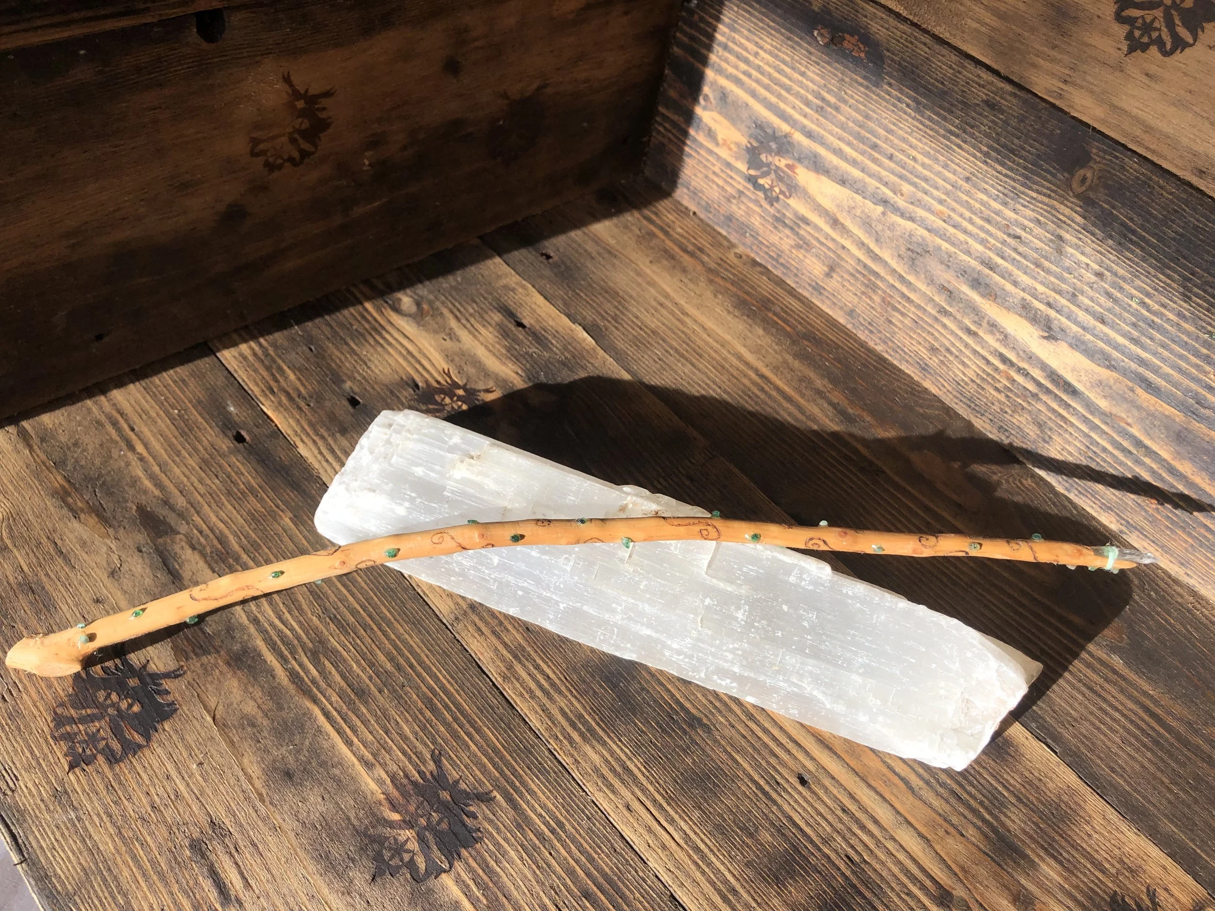 Hawthorn, adorned with emeralds a clear quartz tip and pale green cotton.